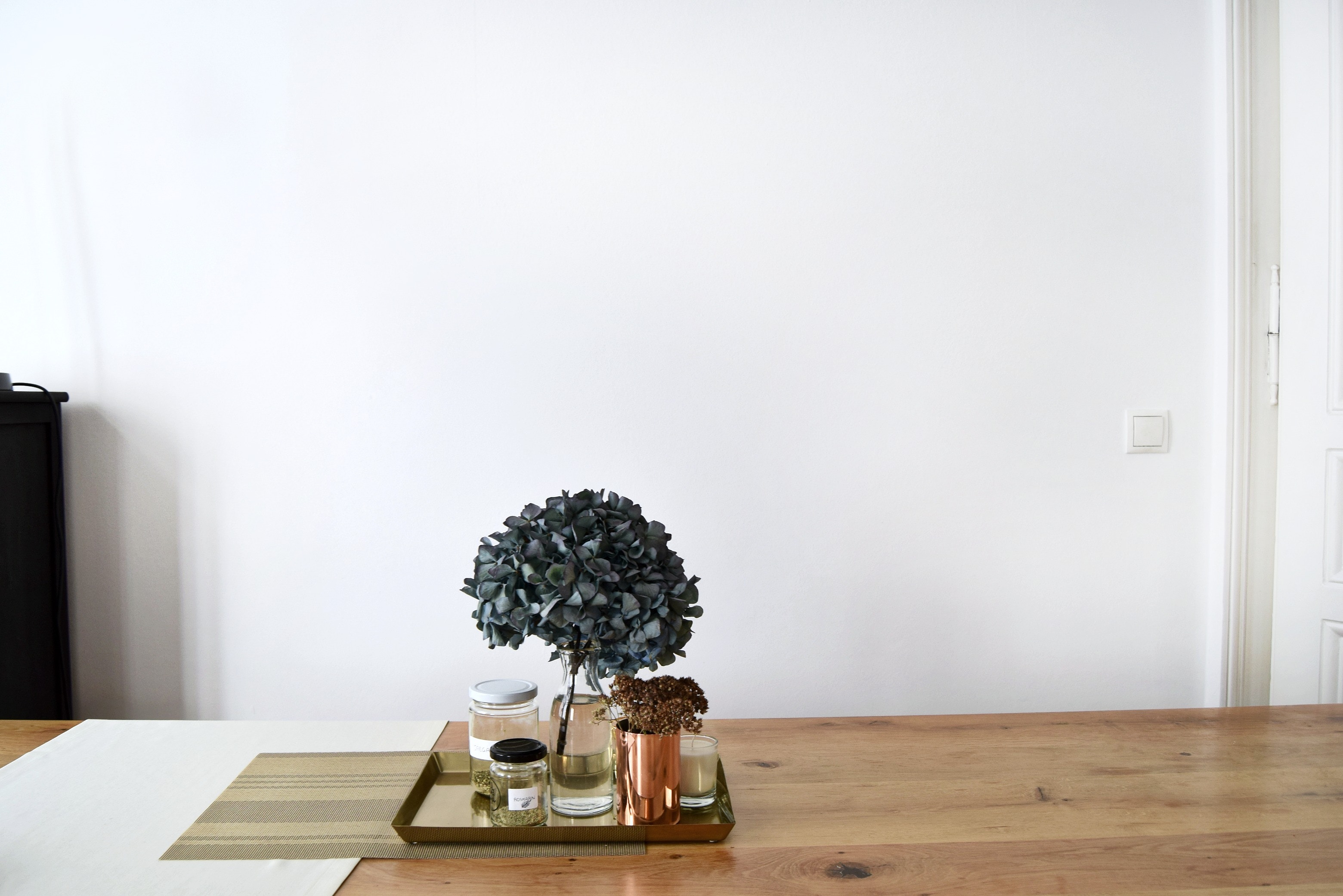 Hydrangea and jars on a golden tray on a wooden table HD Wallpaper