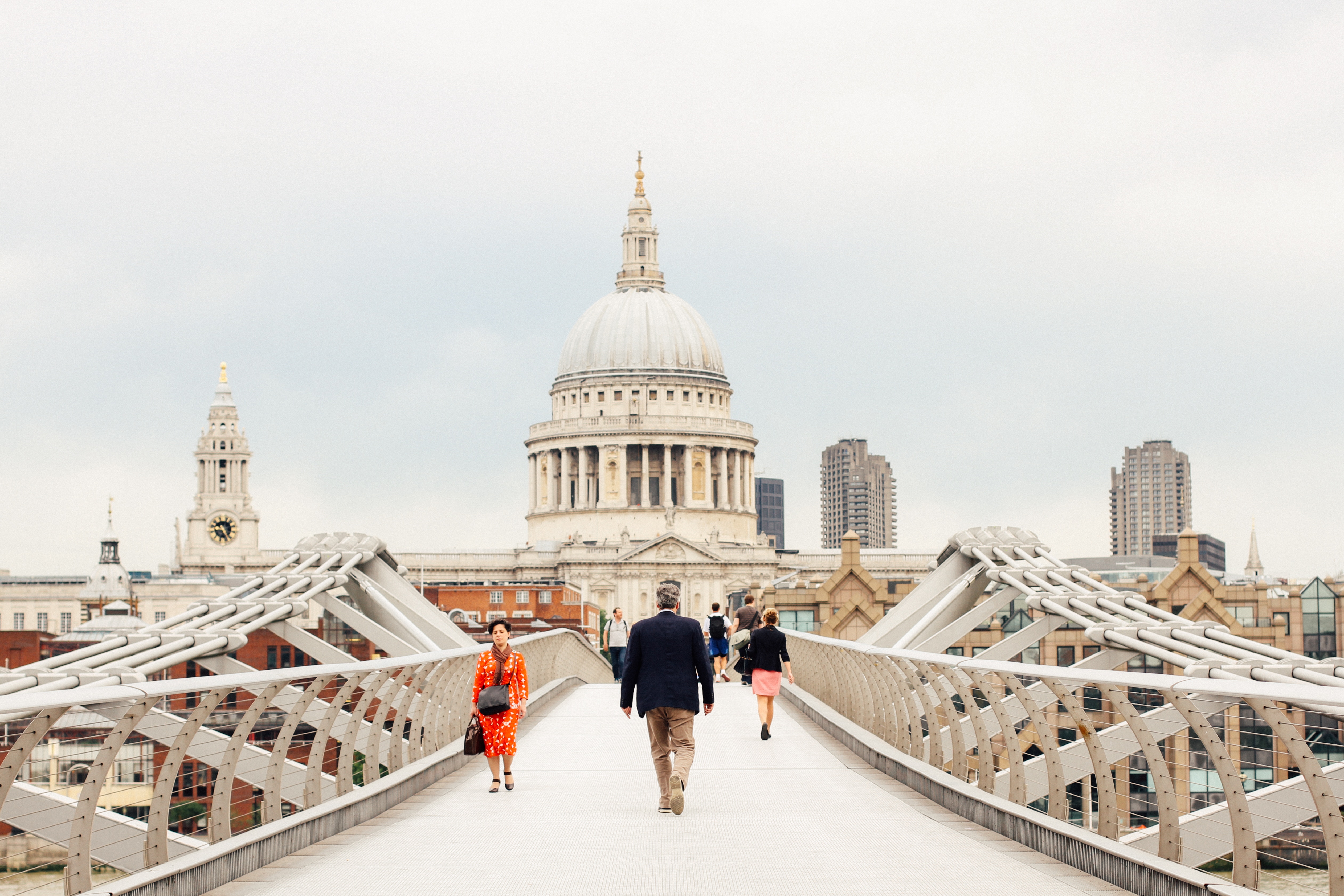 People walking on Millennium Bridge towards St. Paul's Cathedral HD Wallpaper