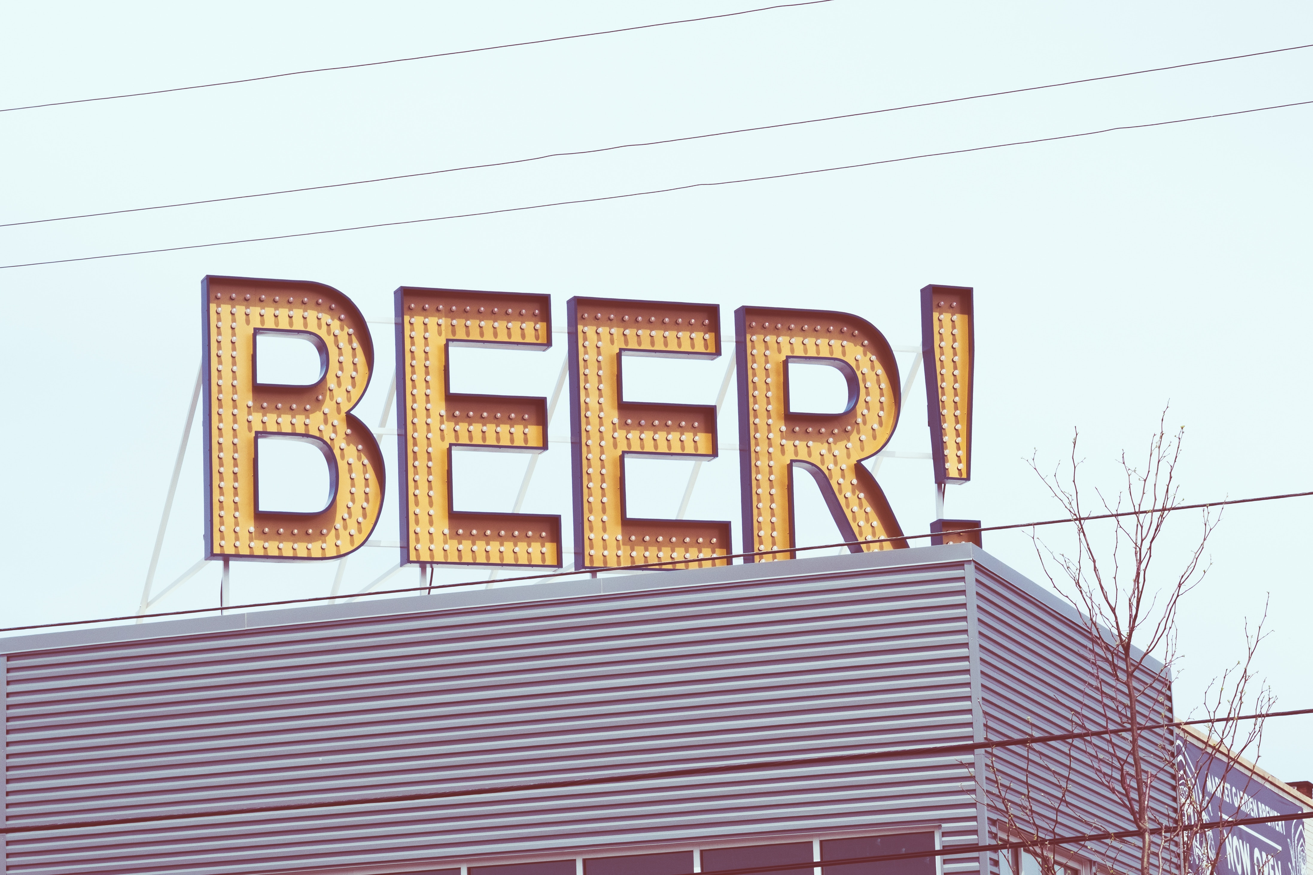 Beer Sign on Industrial Building HD Wallpaper