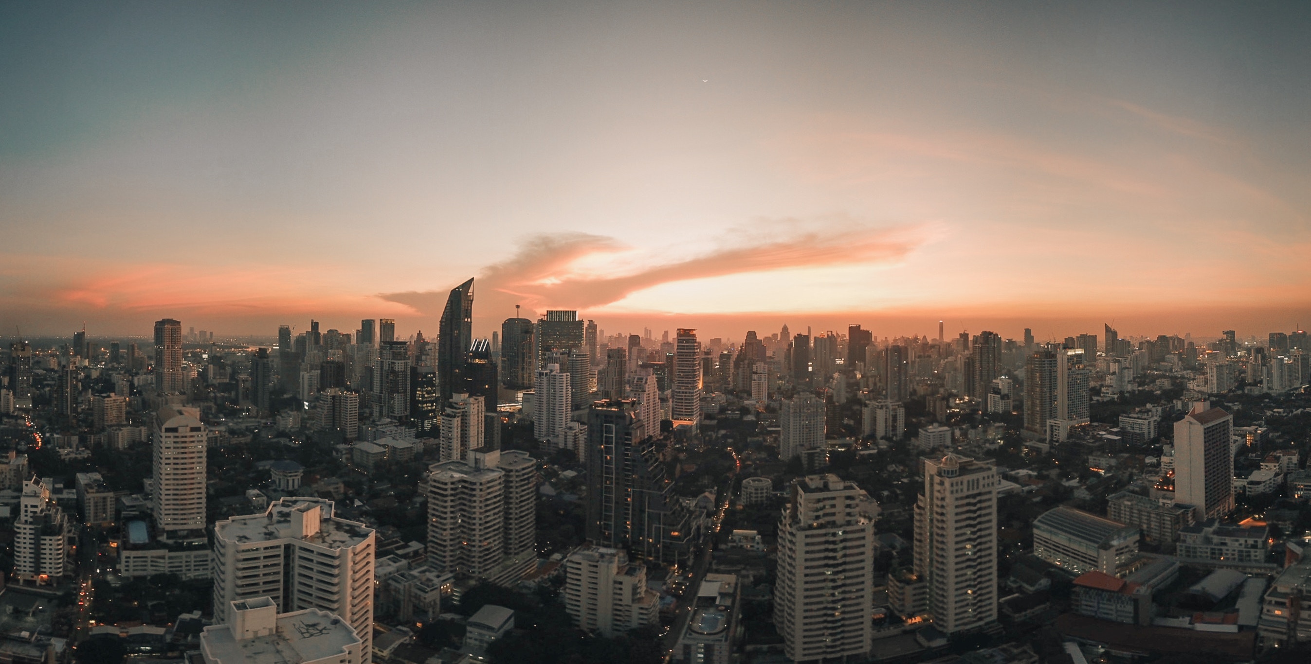 Bangkok cityscape at dusk with orange sky HD Wallpaper