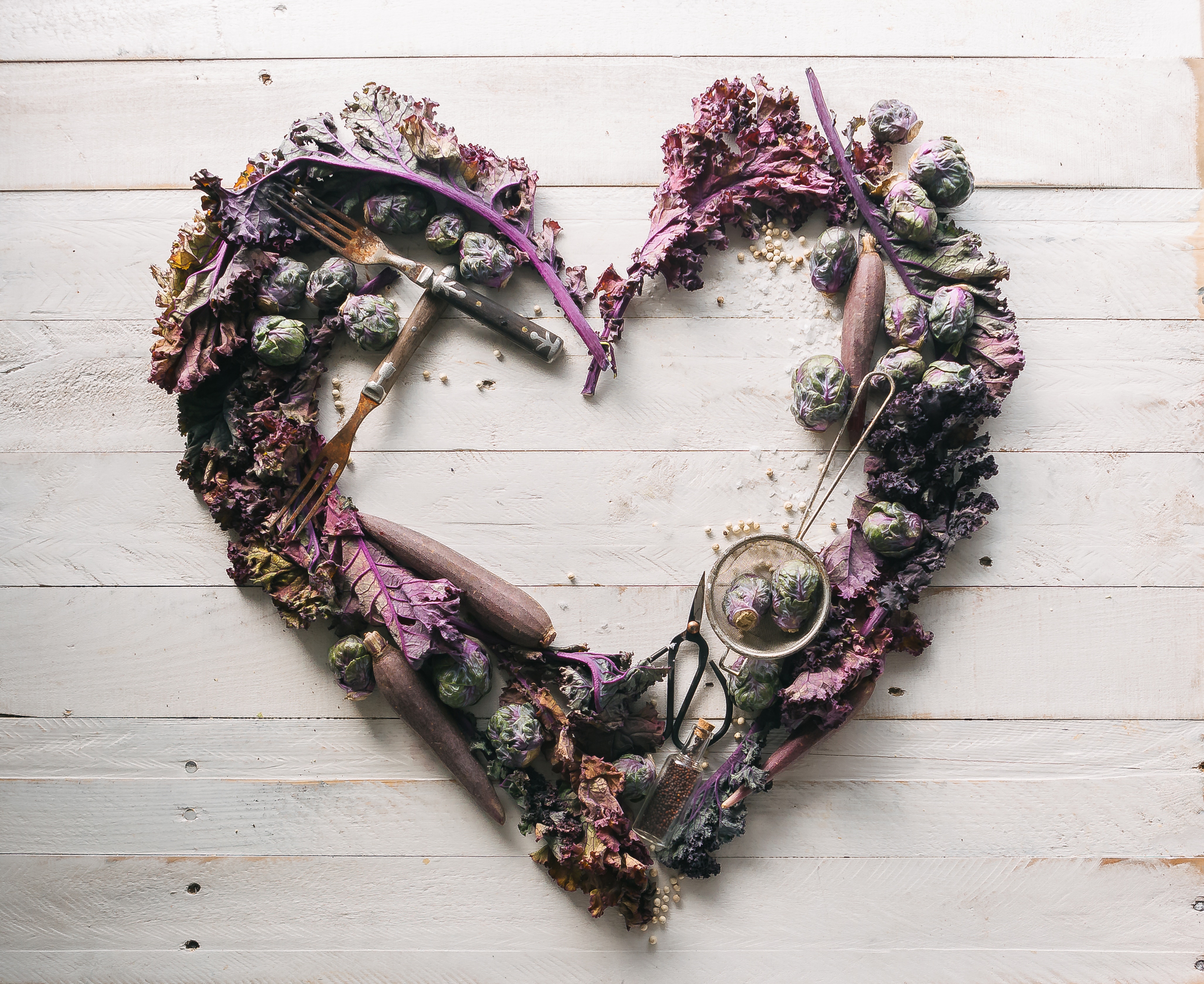 Heart-shaped arrangement of purple vegetables and utensils HD Wallpaper