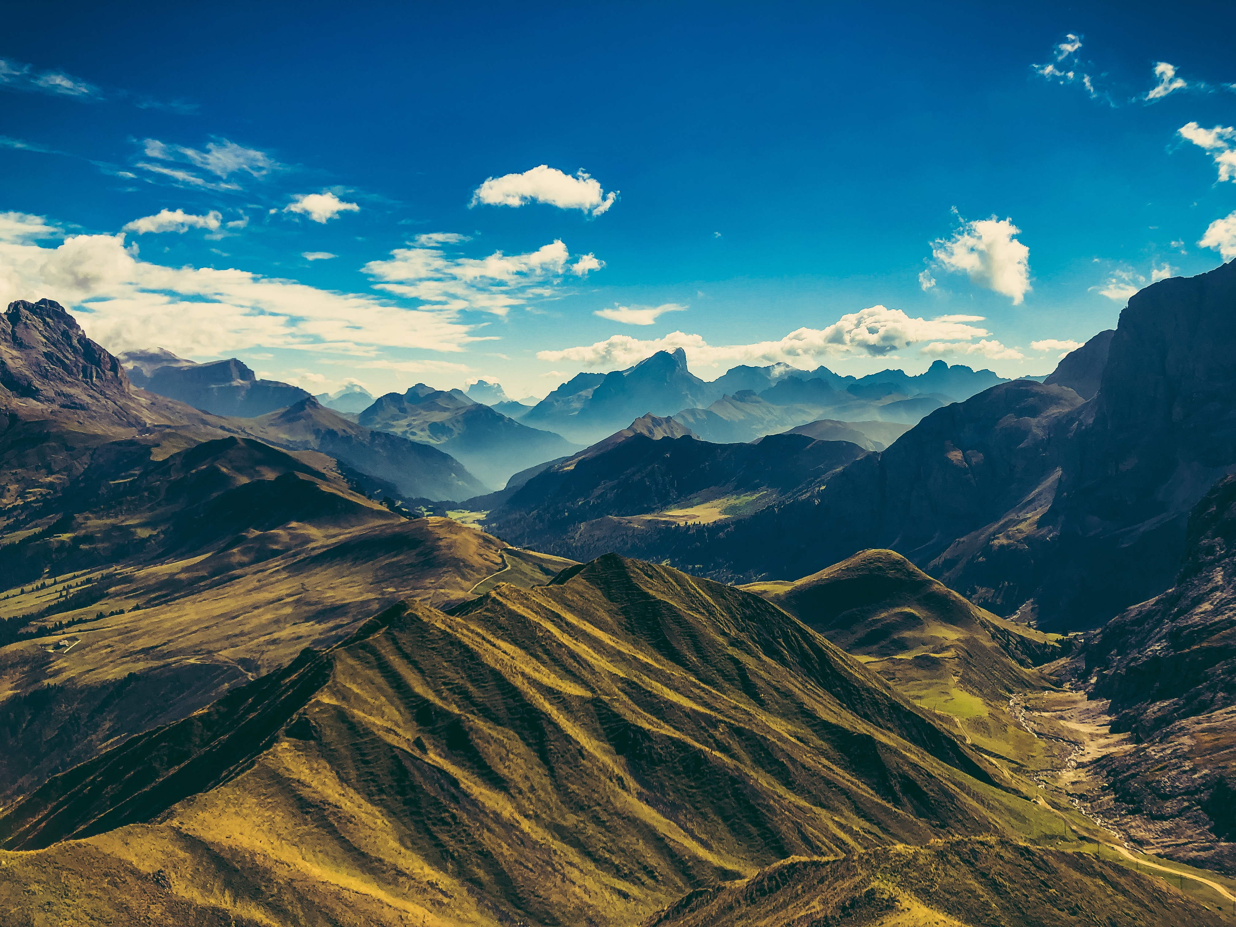 Vast mountain landscape with blue sky and clouds HD Wallpaper