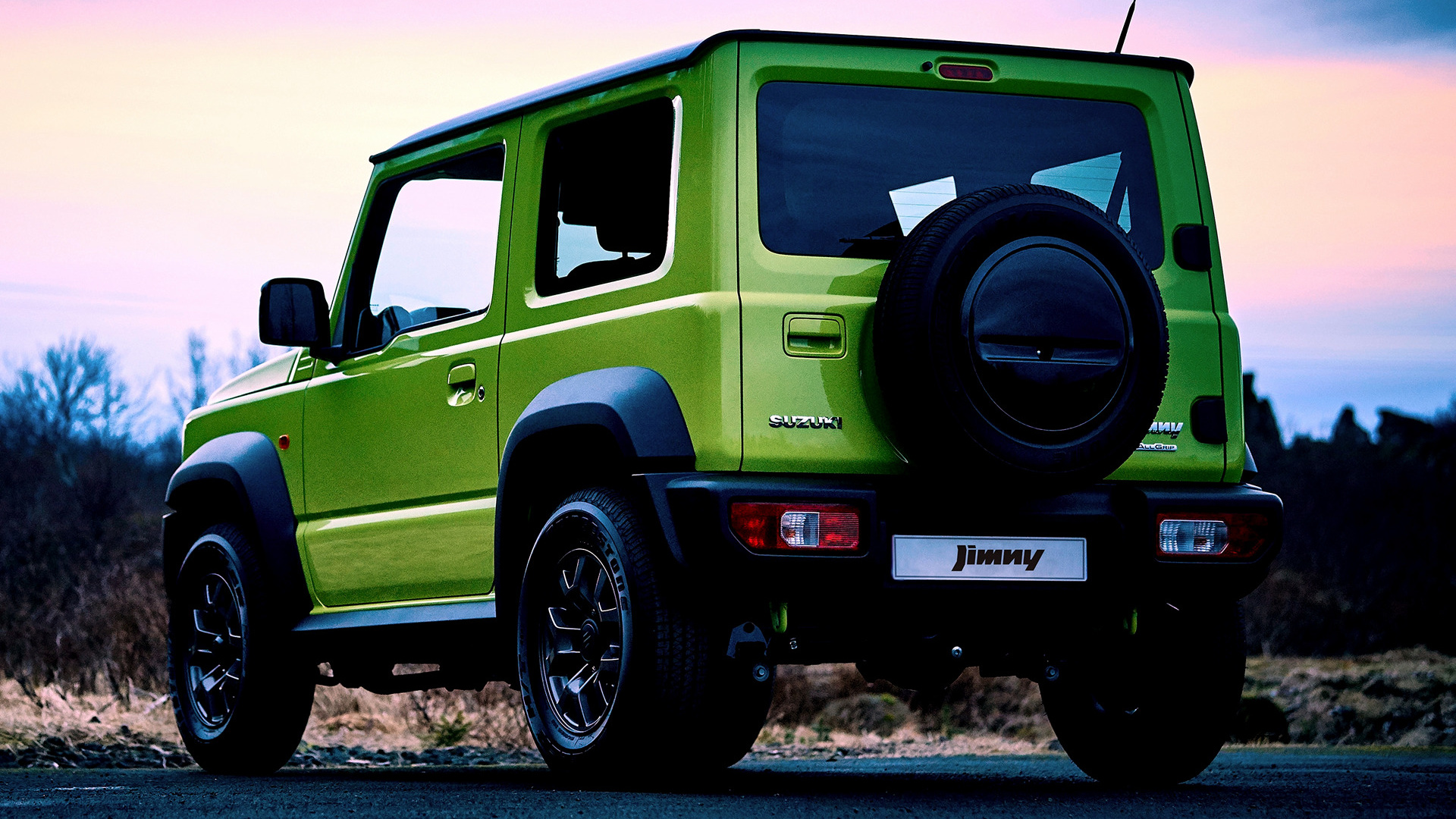 Green Suzuki Jimny parked on a road HD Wallpaper