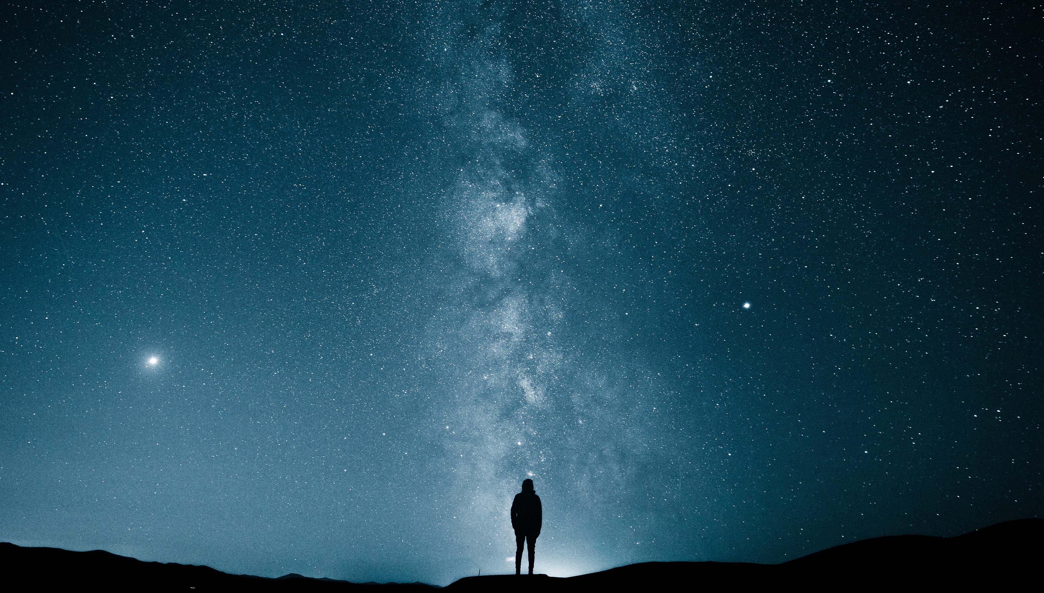 Person standing under the Milky Way galaxy HD Wallpaper