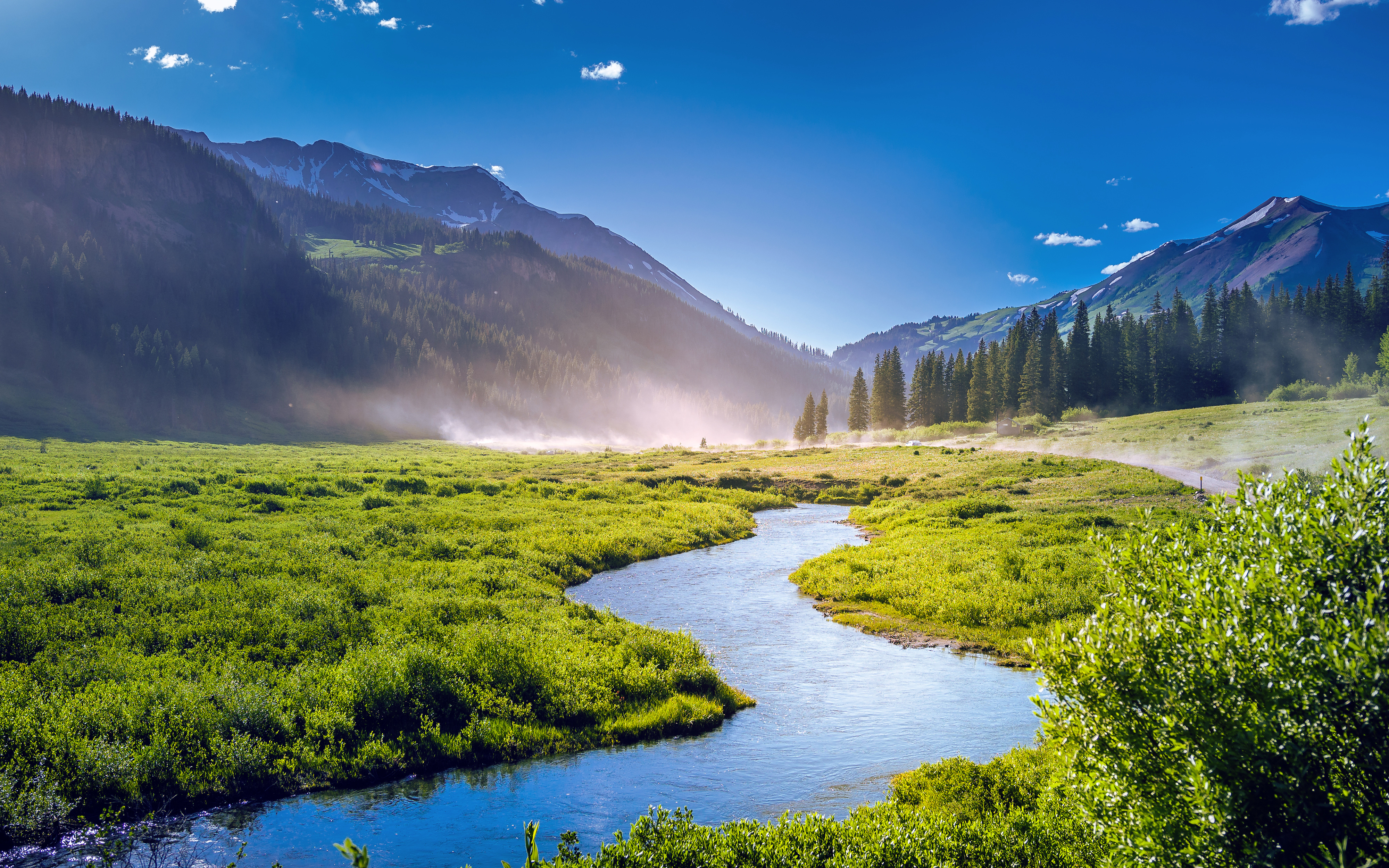 River flowing through a green valley with mountains in Colorado HD Wallpaper