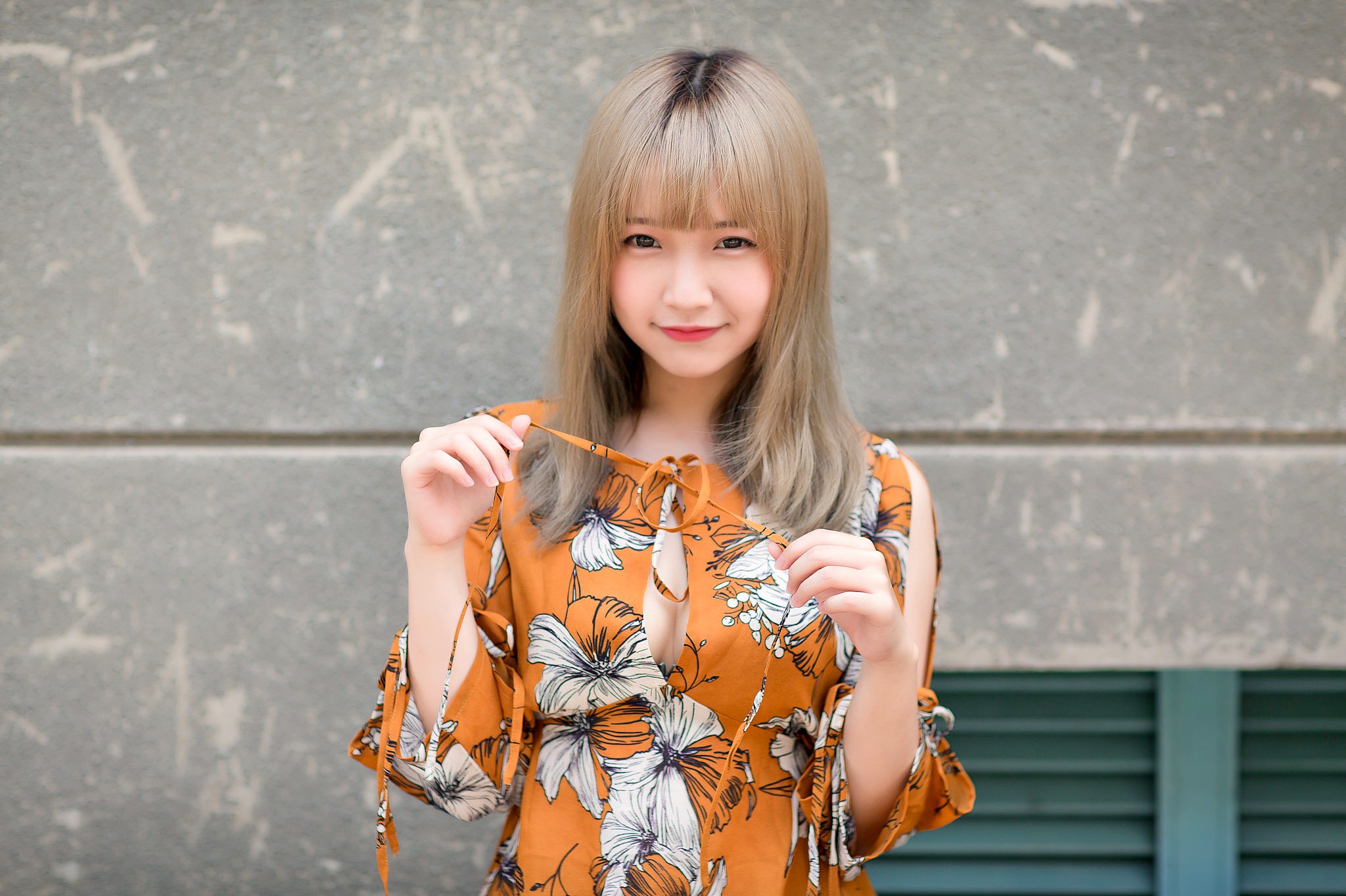 Asian girl with blonde hair in an orange floral dress HD Wallpaper