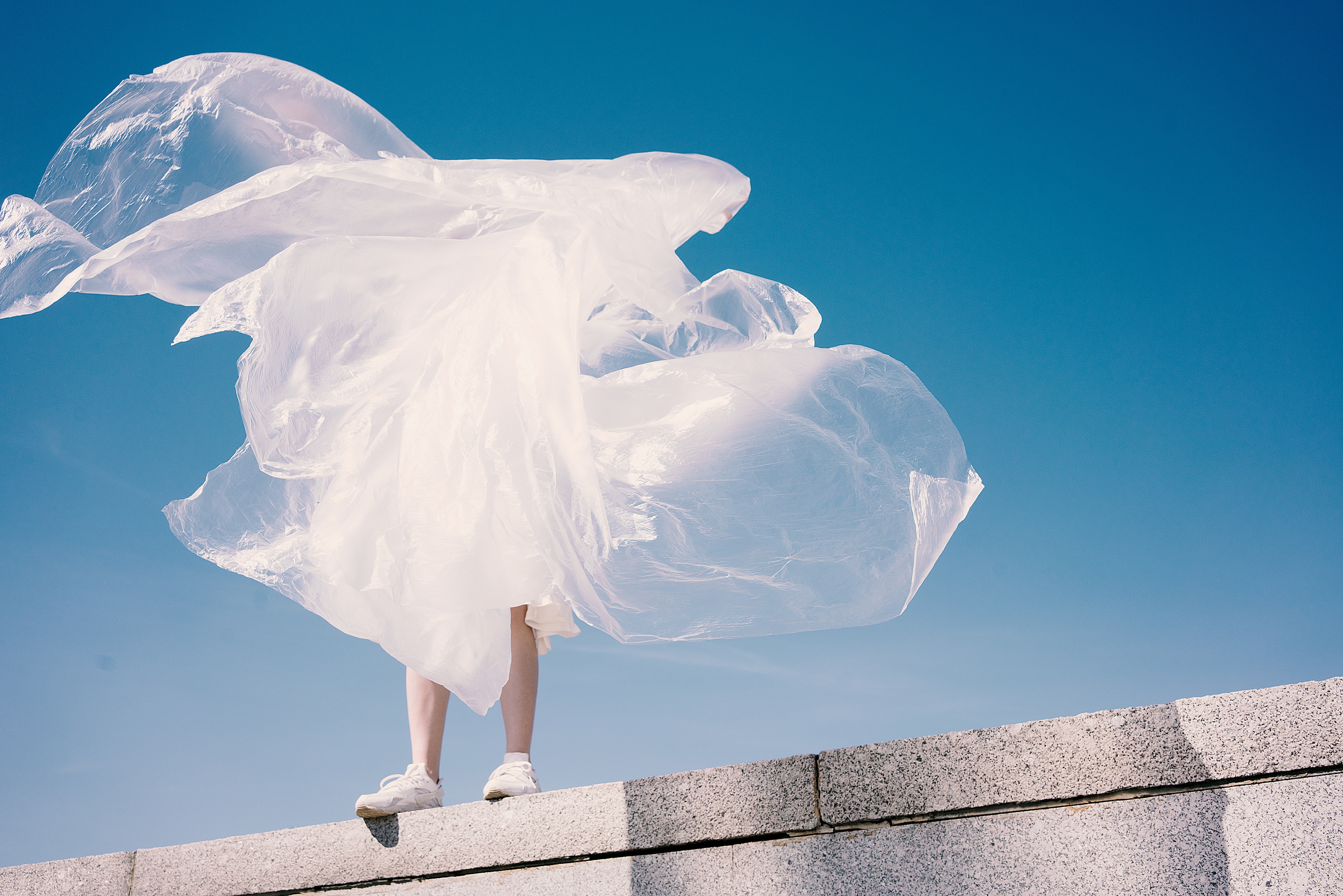 Girl in white fabric against blue sky HD Wallpaper
