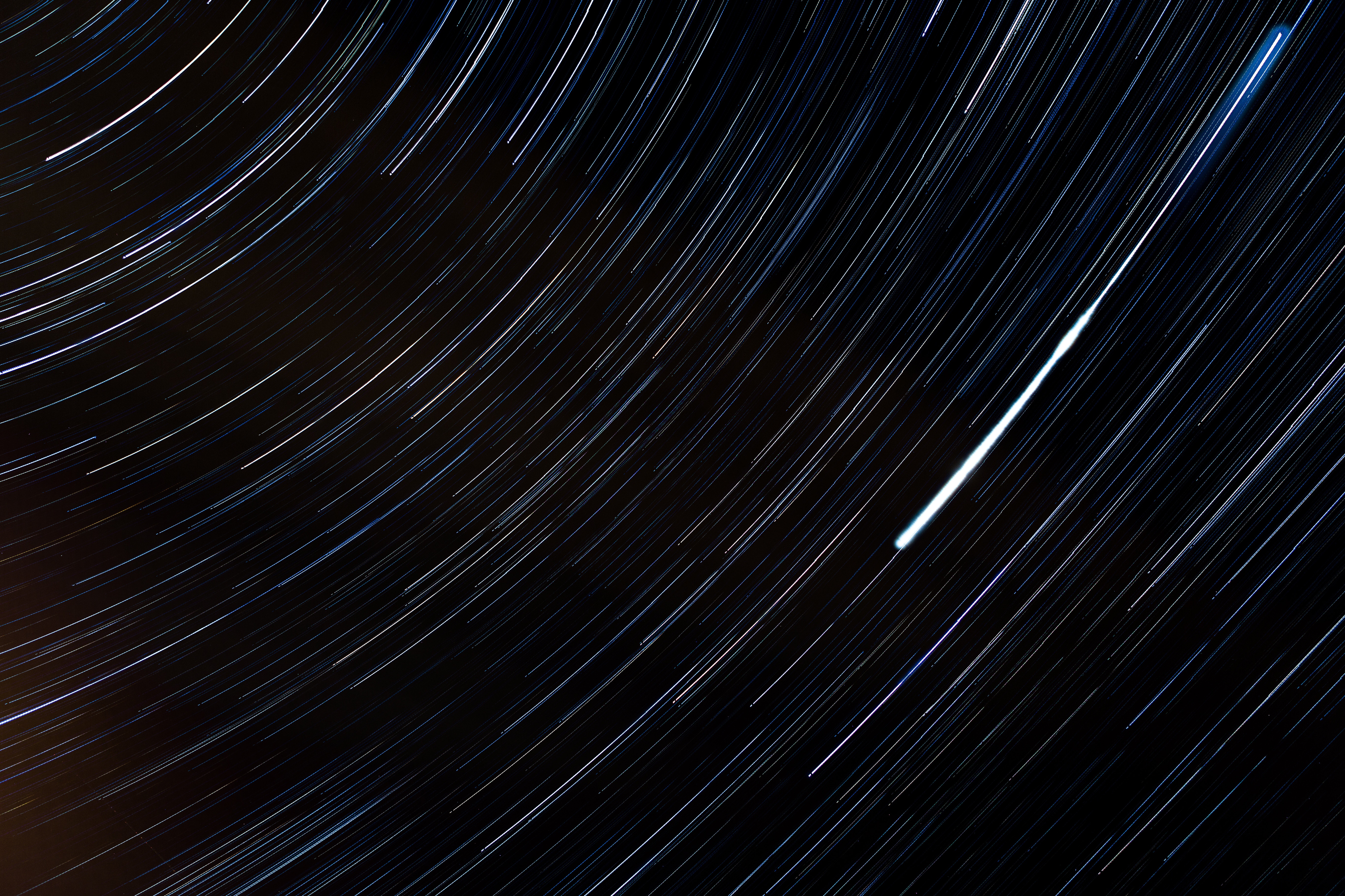 Star trails in the night sky HD Wallpaper