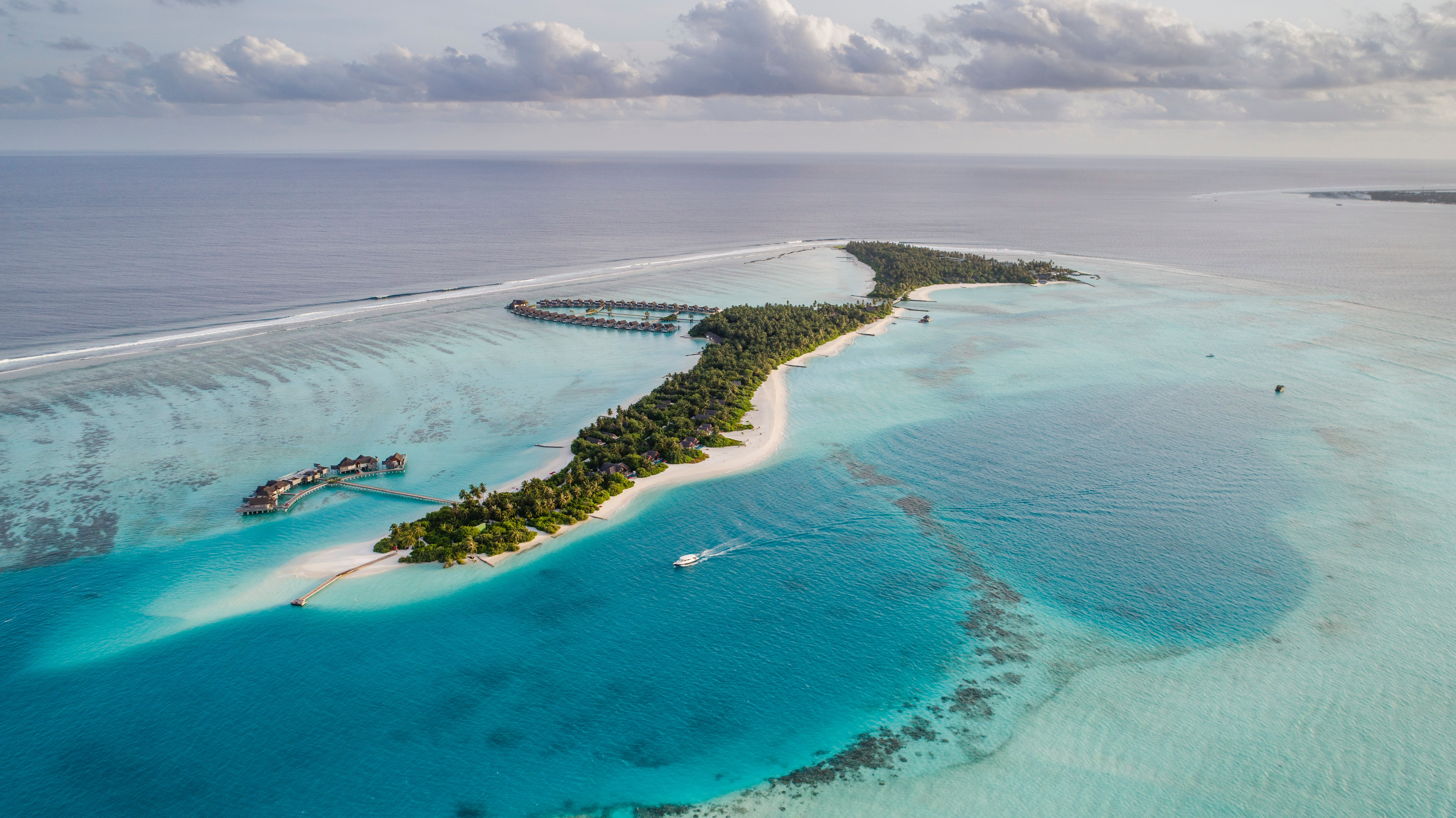 Aerial view of a tropical island resort in the Maldives HD Wallpaper