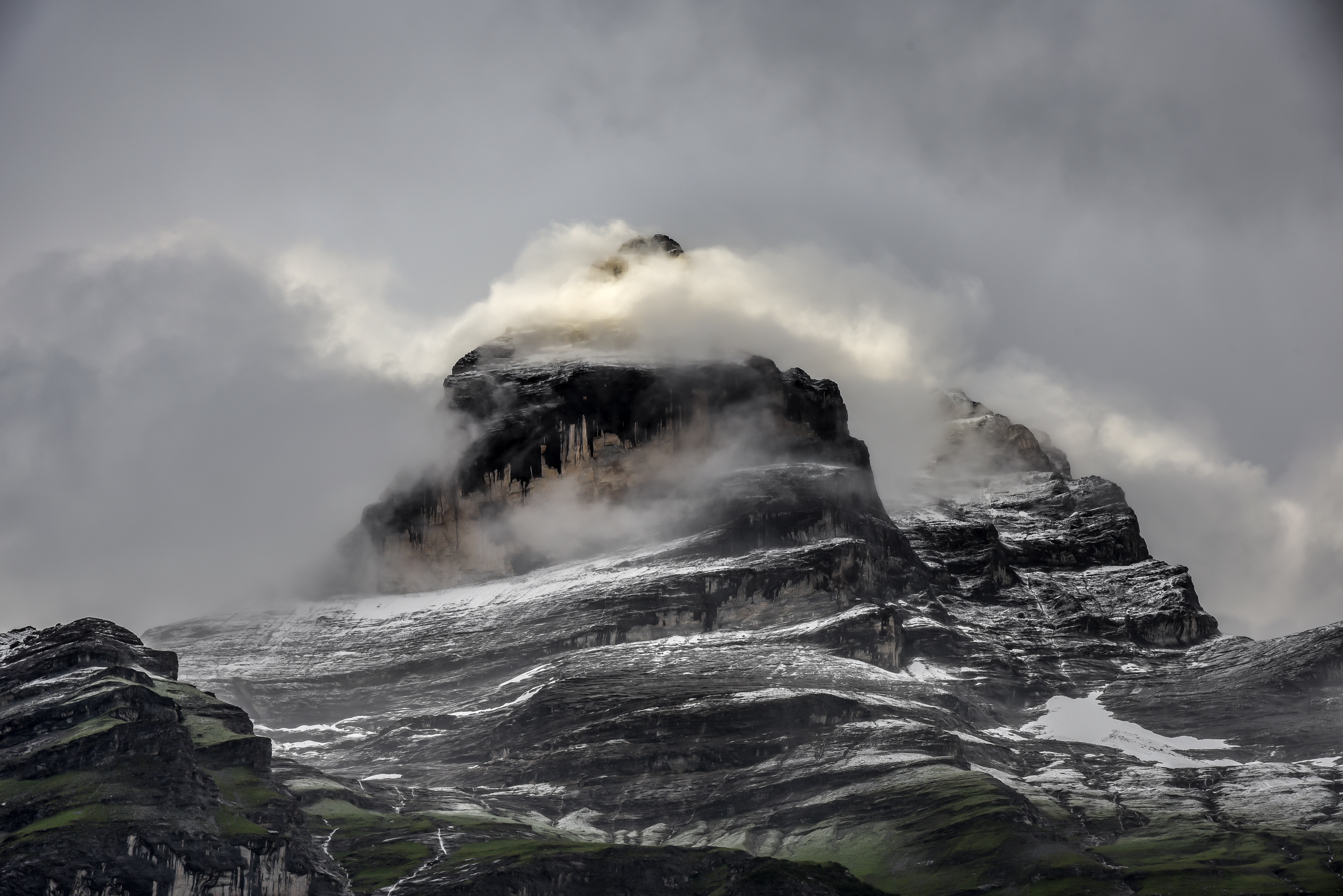 Misty mountain peak with snow and clouds HD Wallpaper