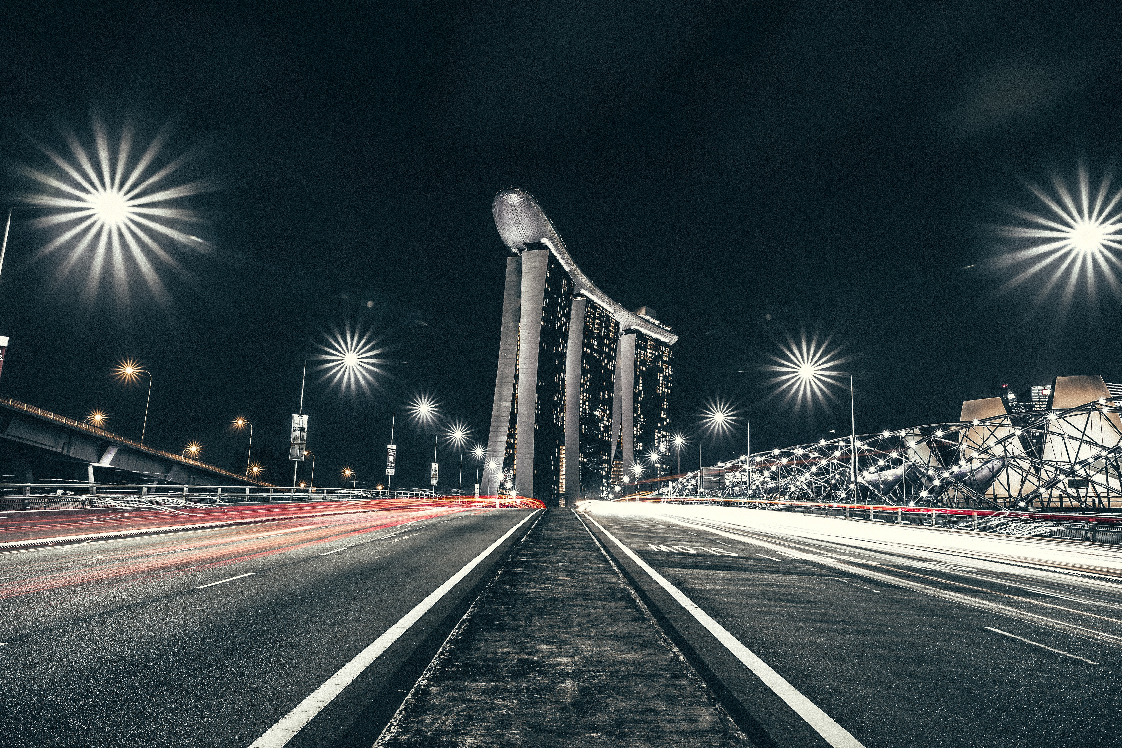Marina Bay Sands at night with light trails HD Wallpaper