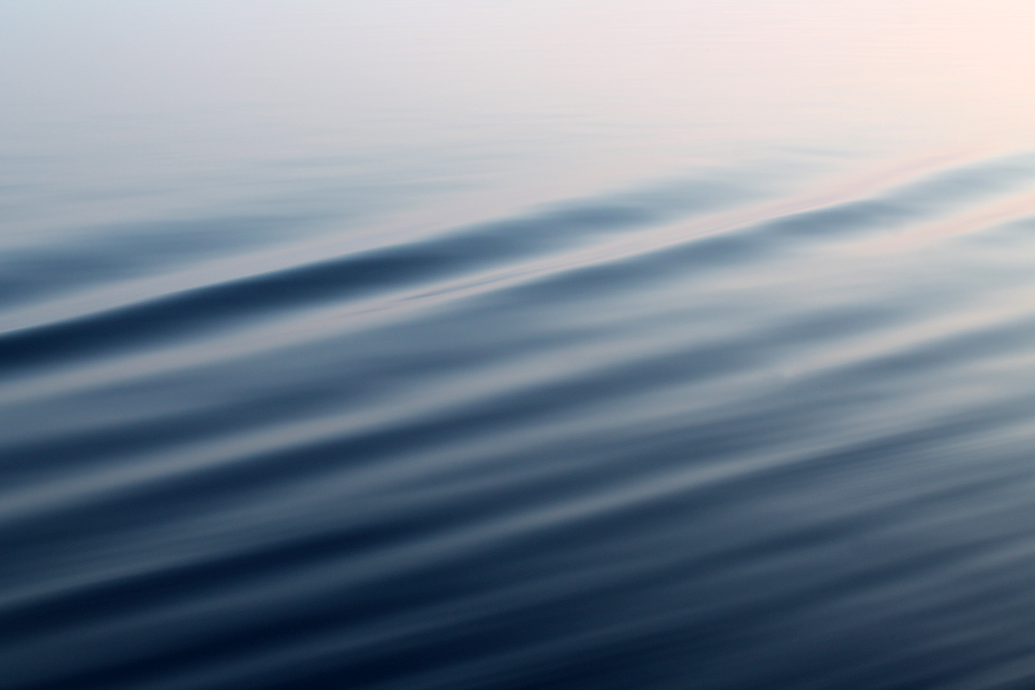Calm Blue Waves Reflecting Soft Sunset Light HD Wallpaper
