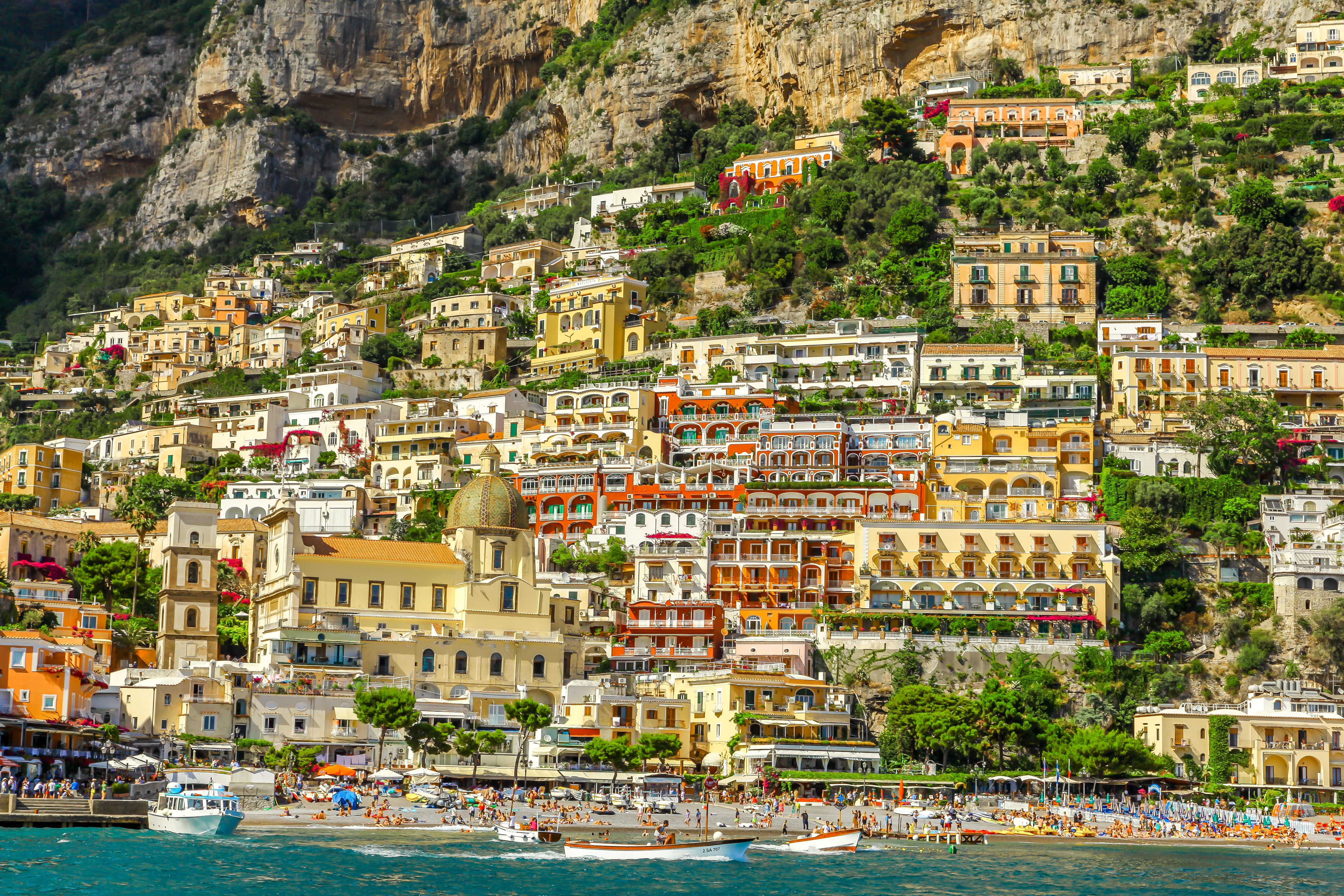 Colorful coastal village built on a steep mountain overlooking the sea HD Wallpaper