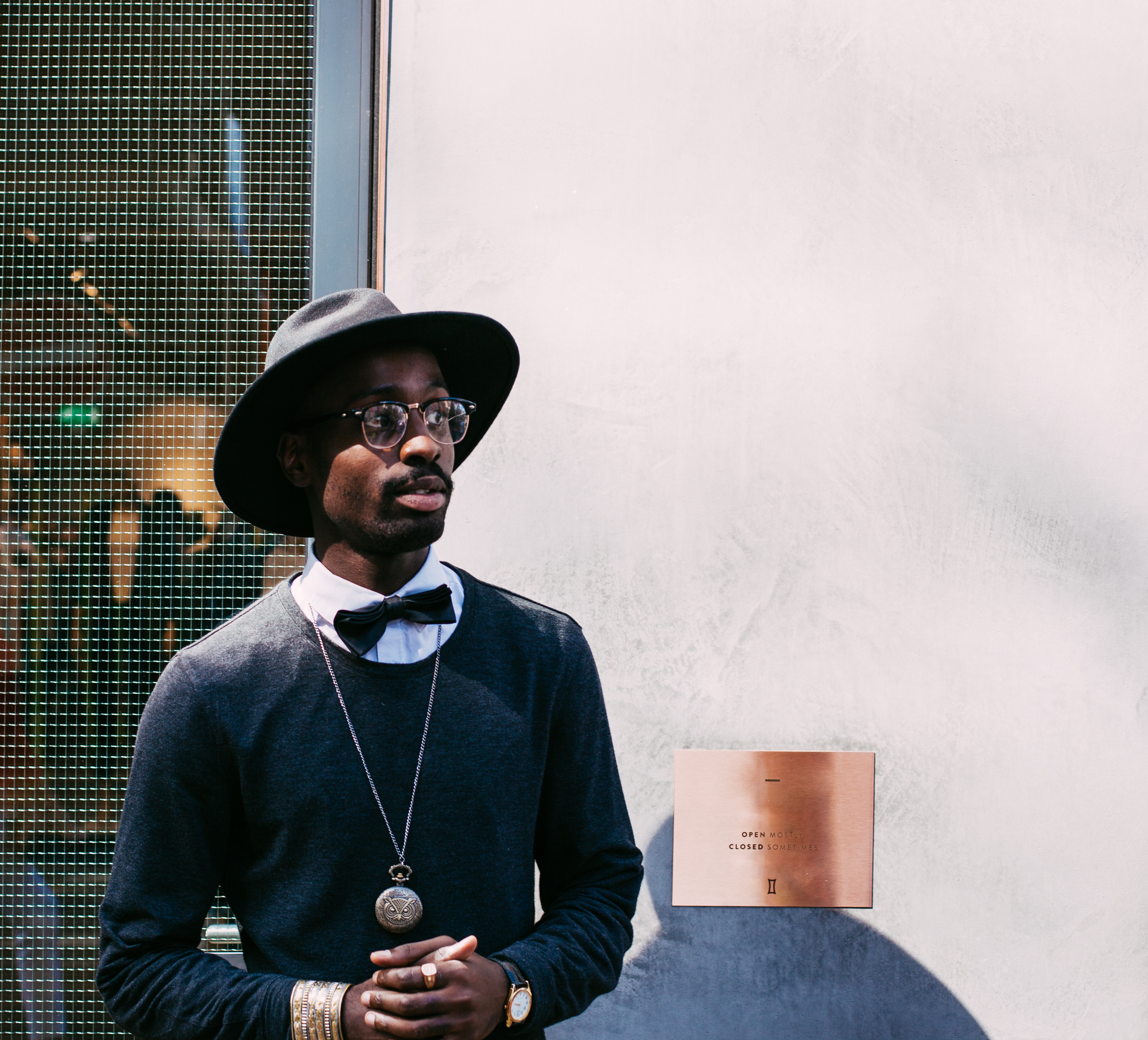 Man in hat and bowtie posing outdoors HD Wallpaper