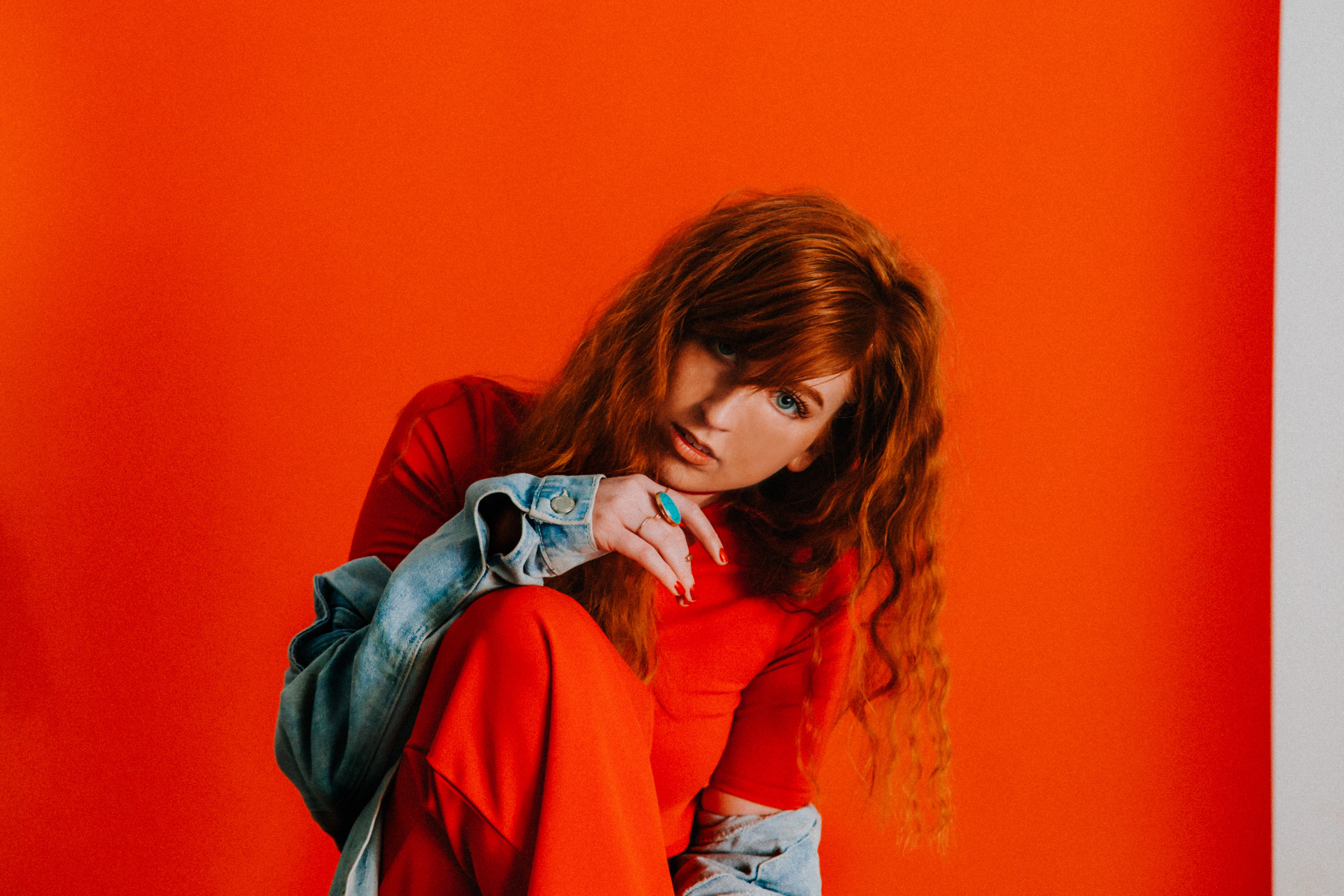 Redhead woman in red top and denim jacket HD Wallpaper
