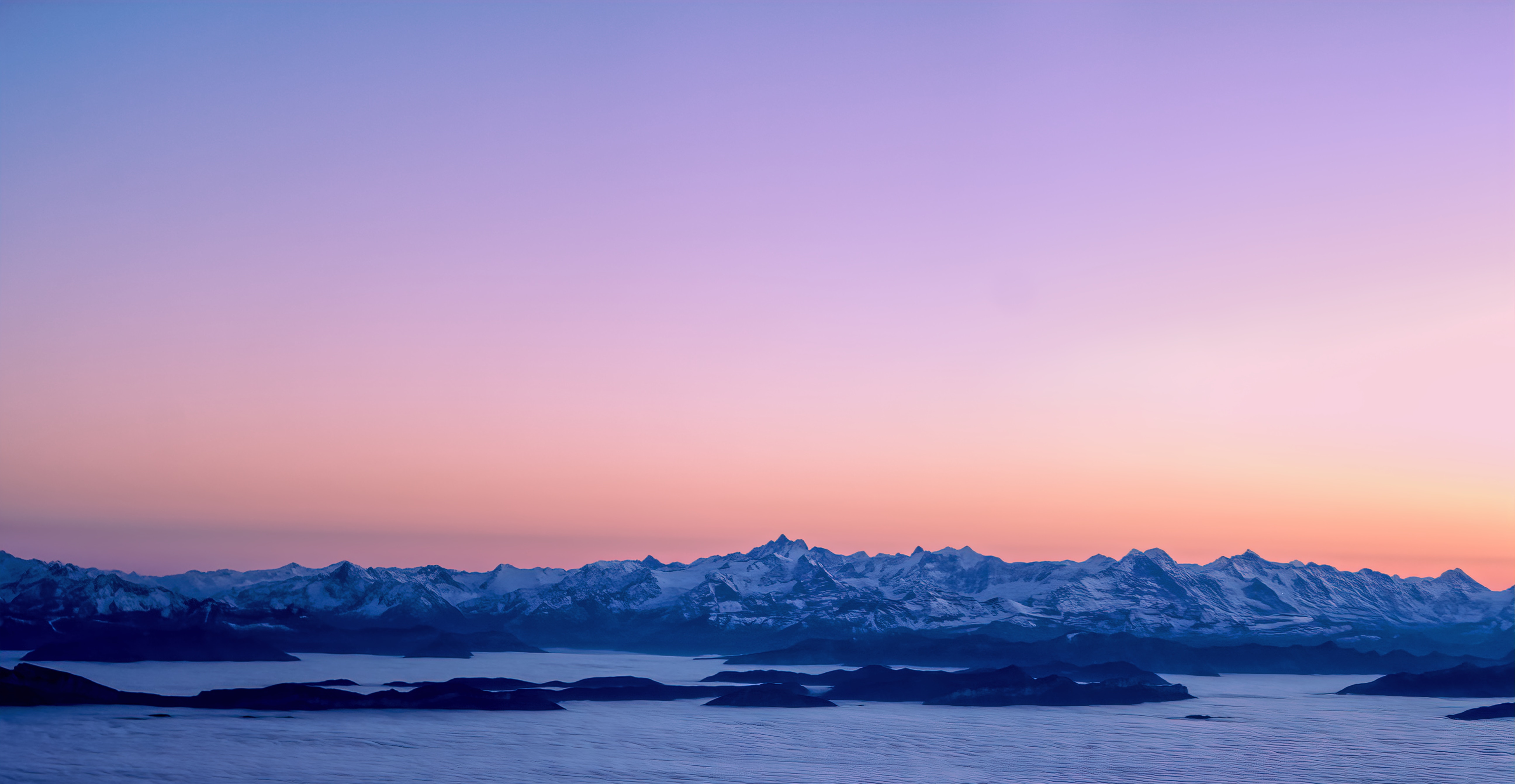 Mountain range at sunrise with clouds HD Wallpaper