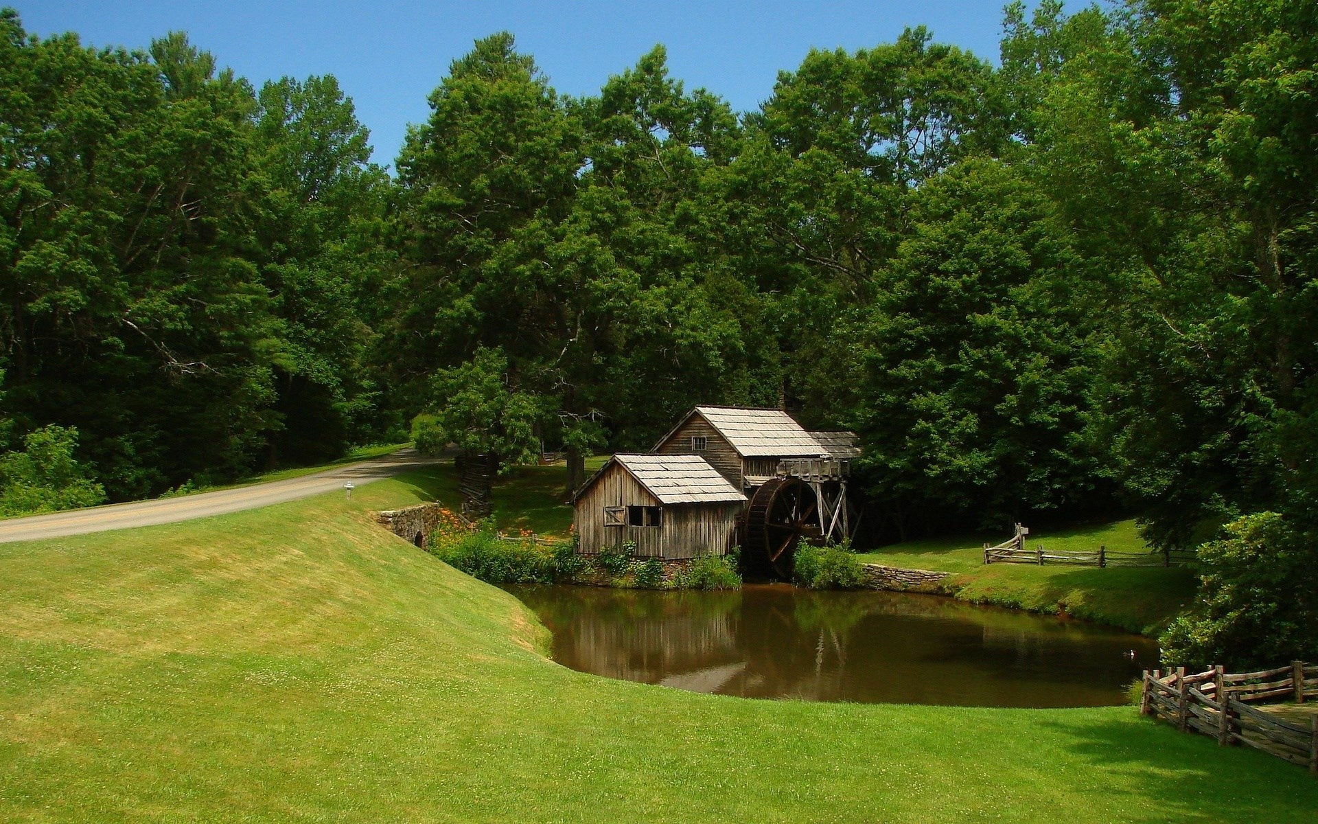 Old water mill by a pond surrounded by trees HD Wallpaper