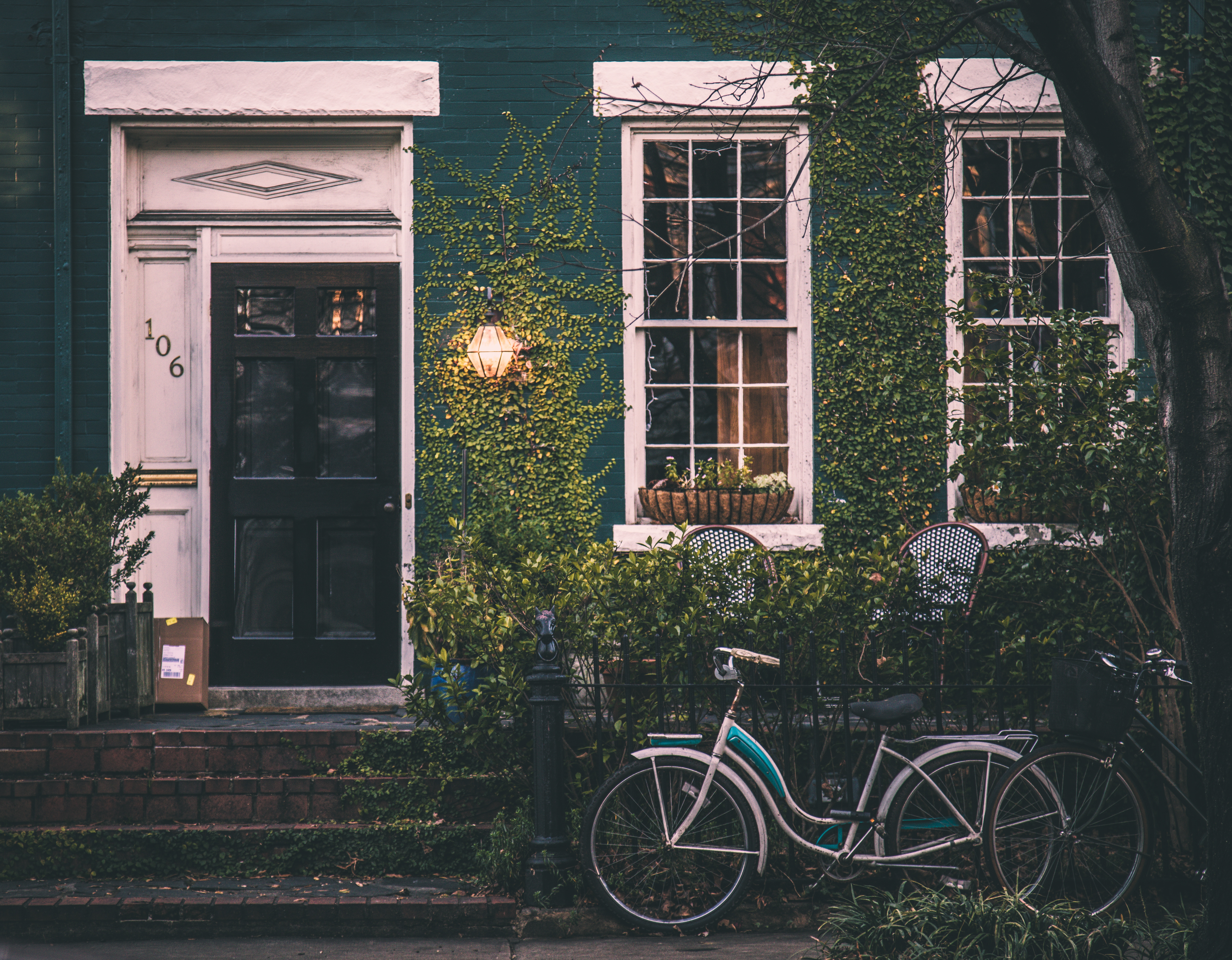 House with a bicycle parked outside HD Wallpaper