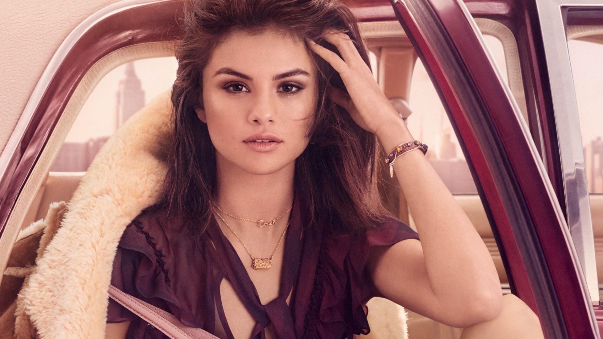 Selena Gomez in a car HD Wallpaper
