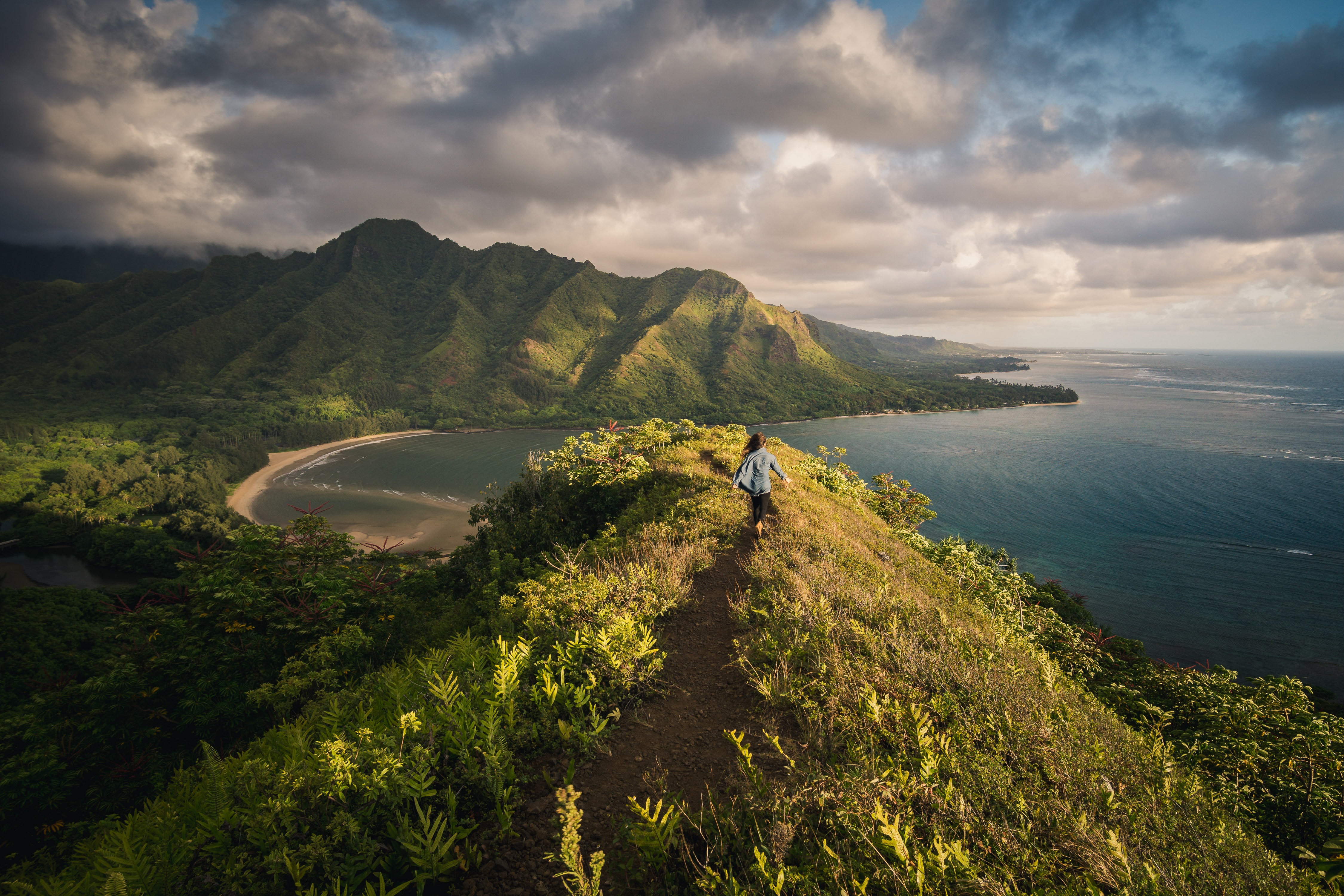 Person hiking on a mountain ridge in Hawaii HD Wallpaper