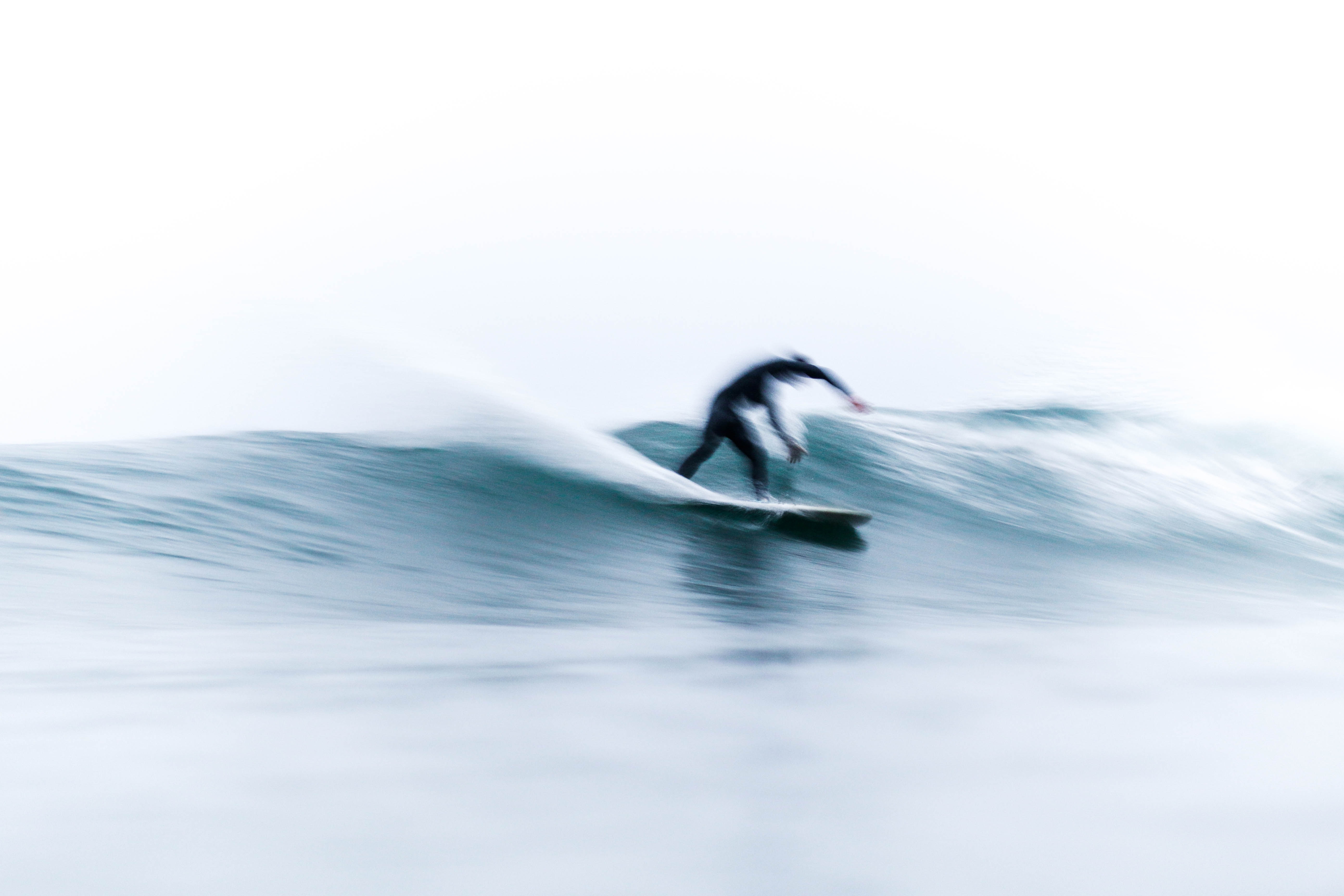 Surfer riding a wave in Malibu HD Wallpaper