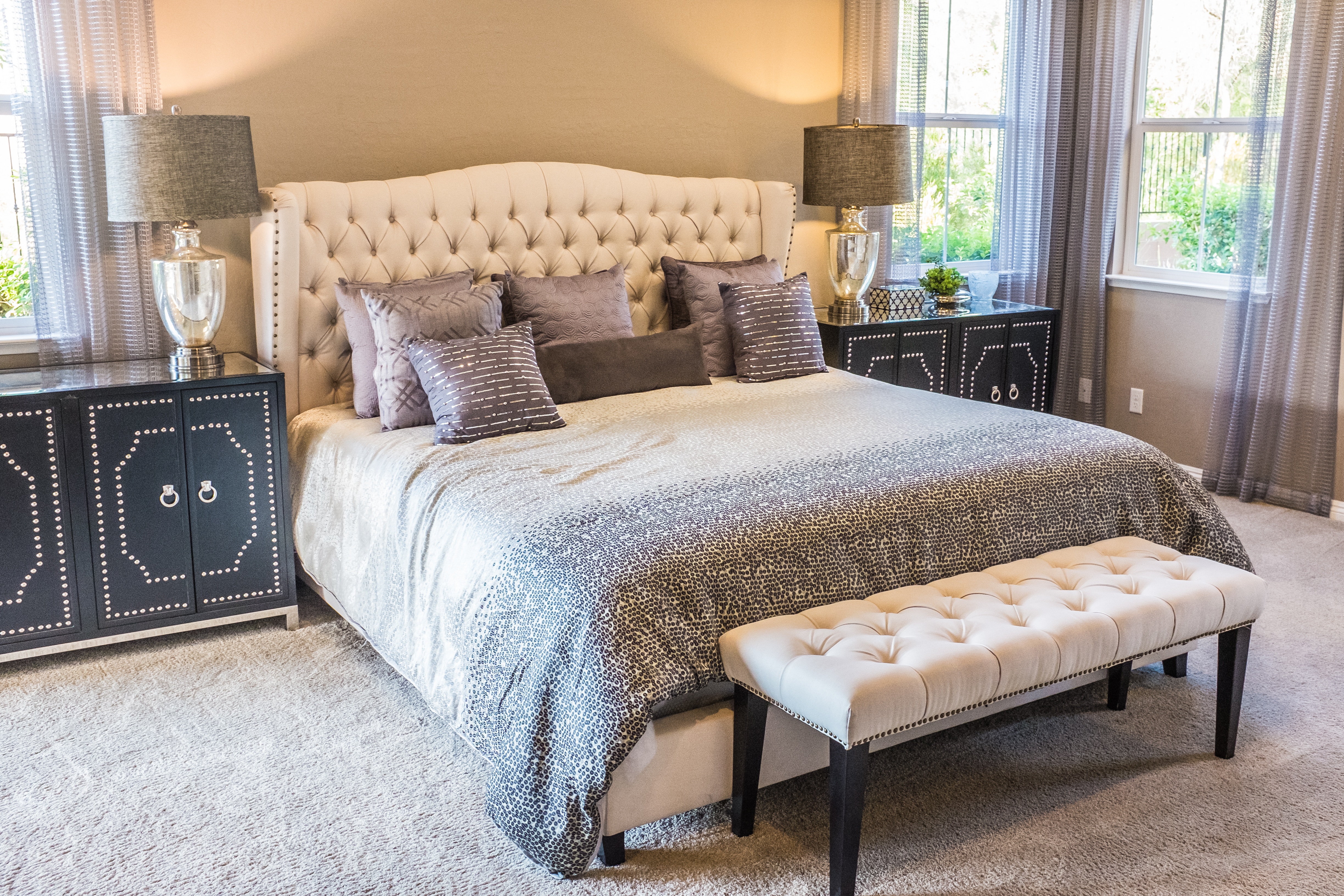 Luxury bedroom with tufted headboard and decorative nightstands HD Wallpaper