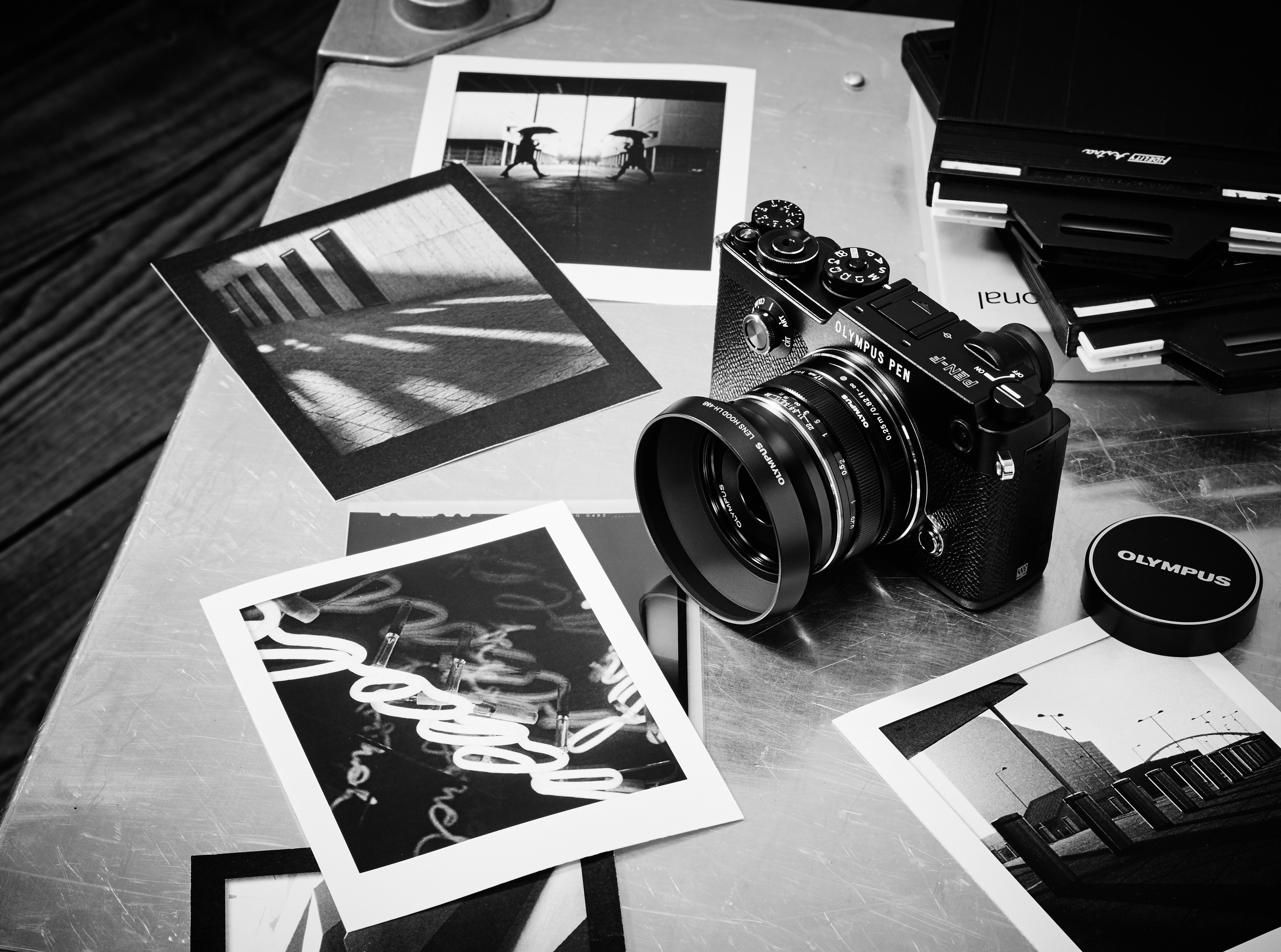 Olympus Pen F camera with photographs HD Wallpaper