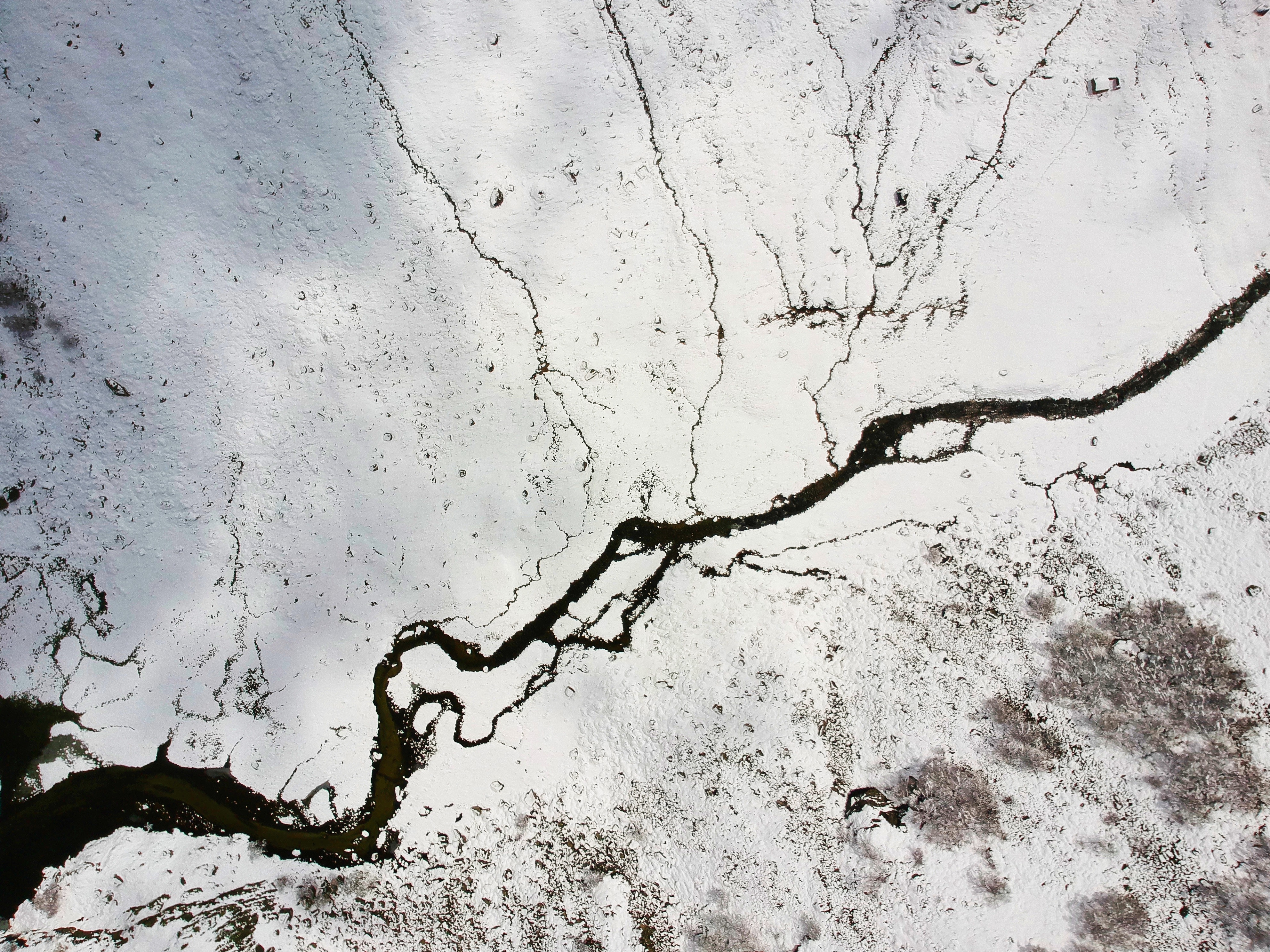 Aerial View of Snow-Covered River and Terrain in France HD Wallpaper