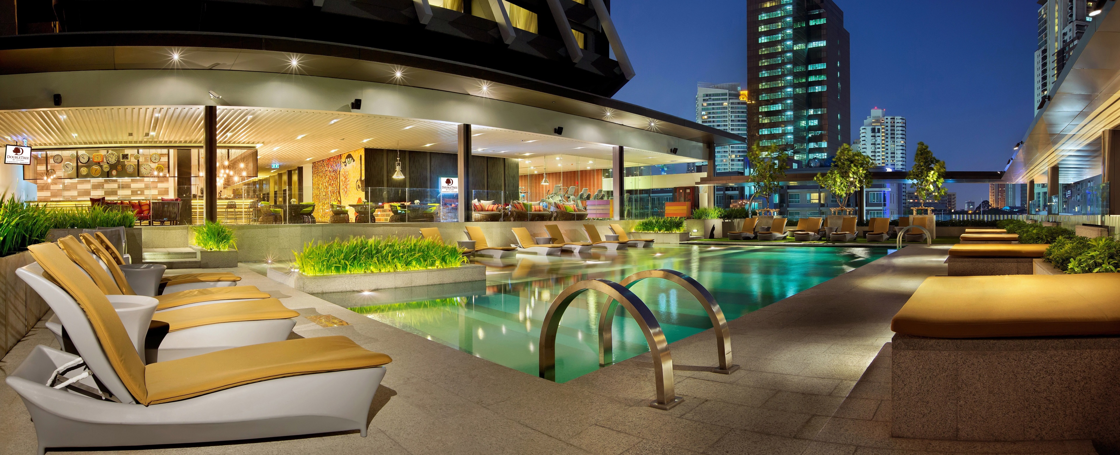 Doubletree by Hilton Hotel rooftop pool at night HD Wallpaper