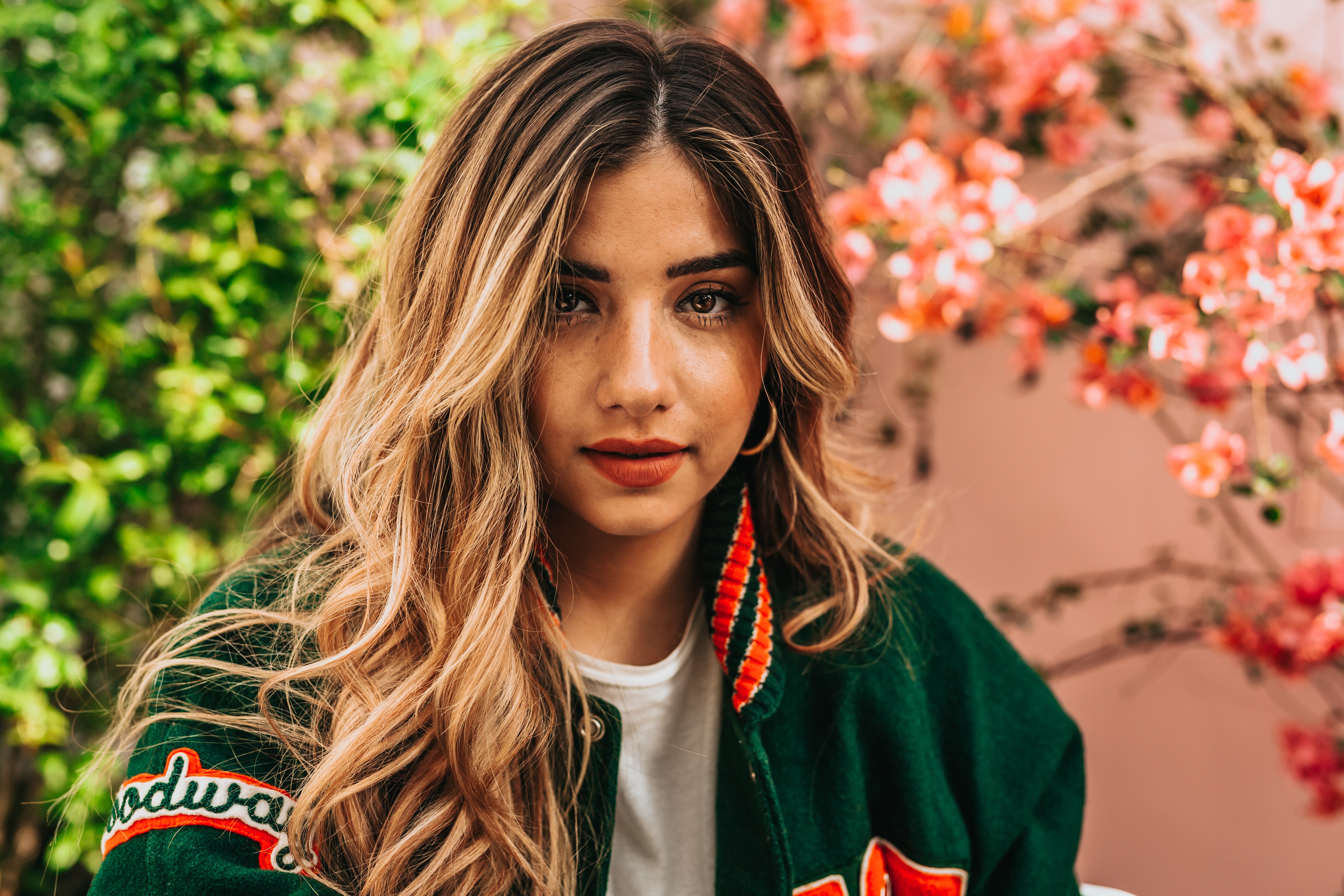 Woman in green jersey coat with blonde hair HD Wallpaper