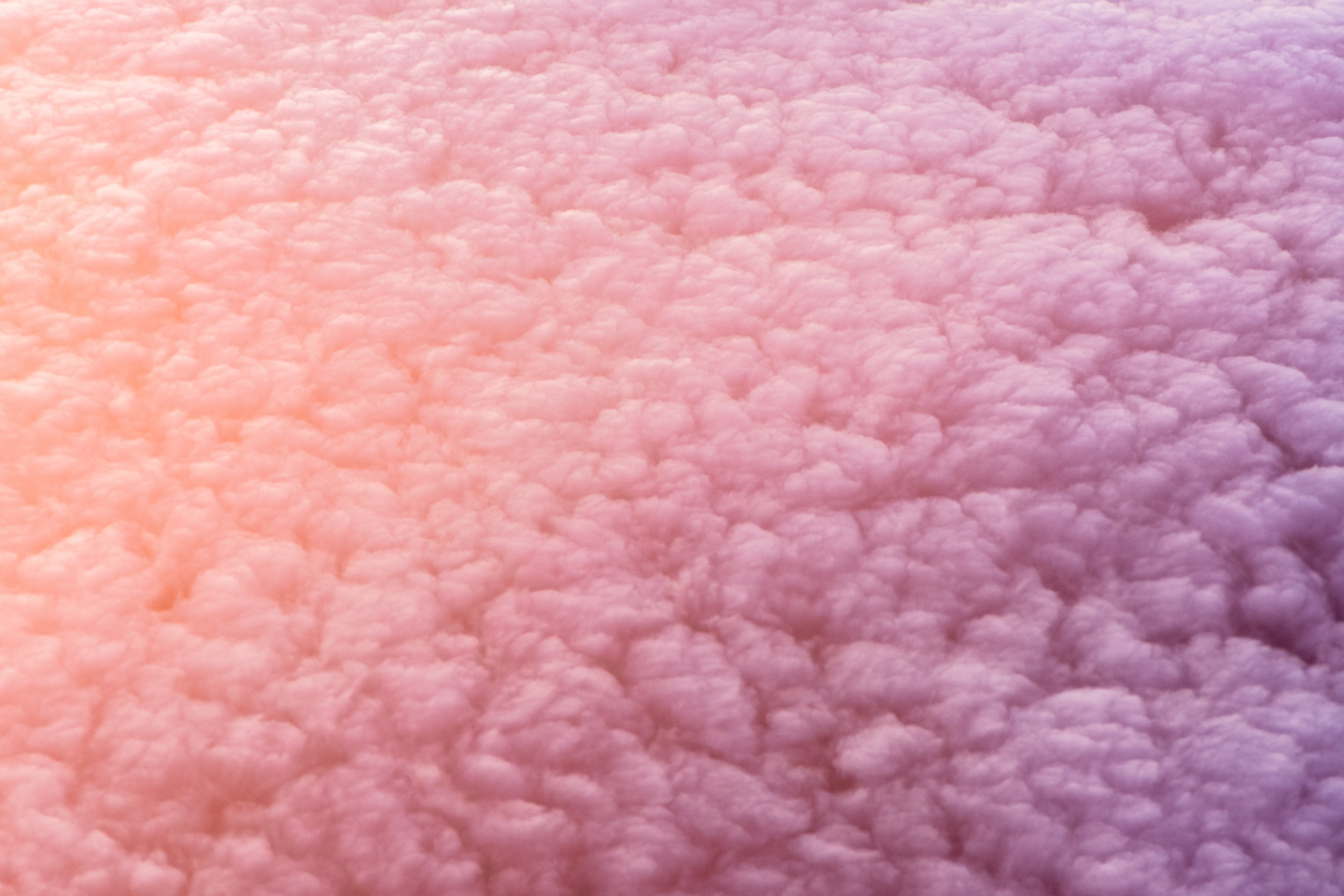 Pink and orange clouds from above during sunset HD Wallpaper