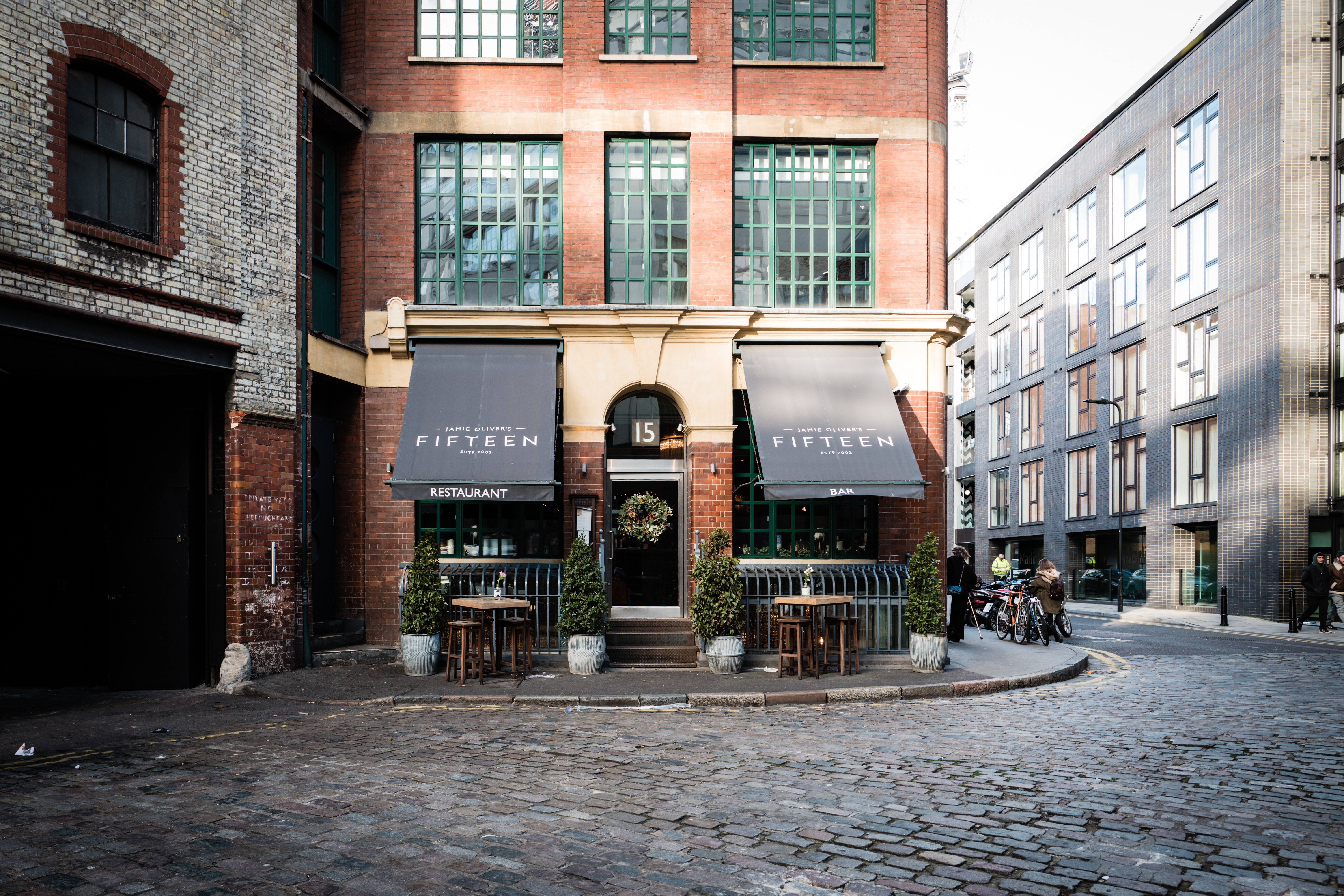 Jamie Oliver's Fifteen Restaurant on a London Cobblestone Street HD Wallpaper