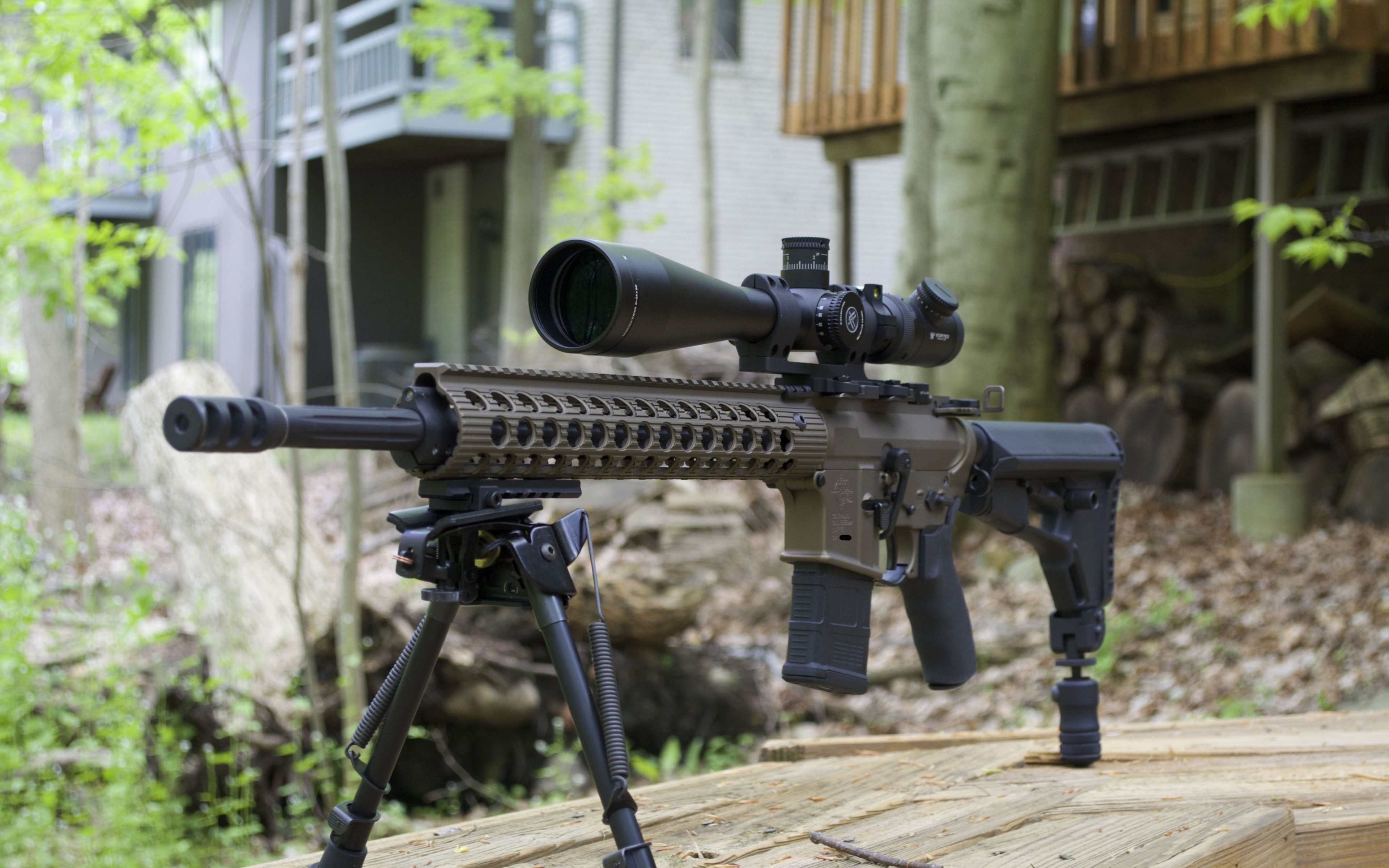 AR-15 rifle with scope on bipod HD Wallpaper