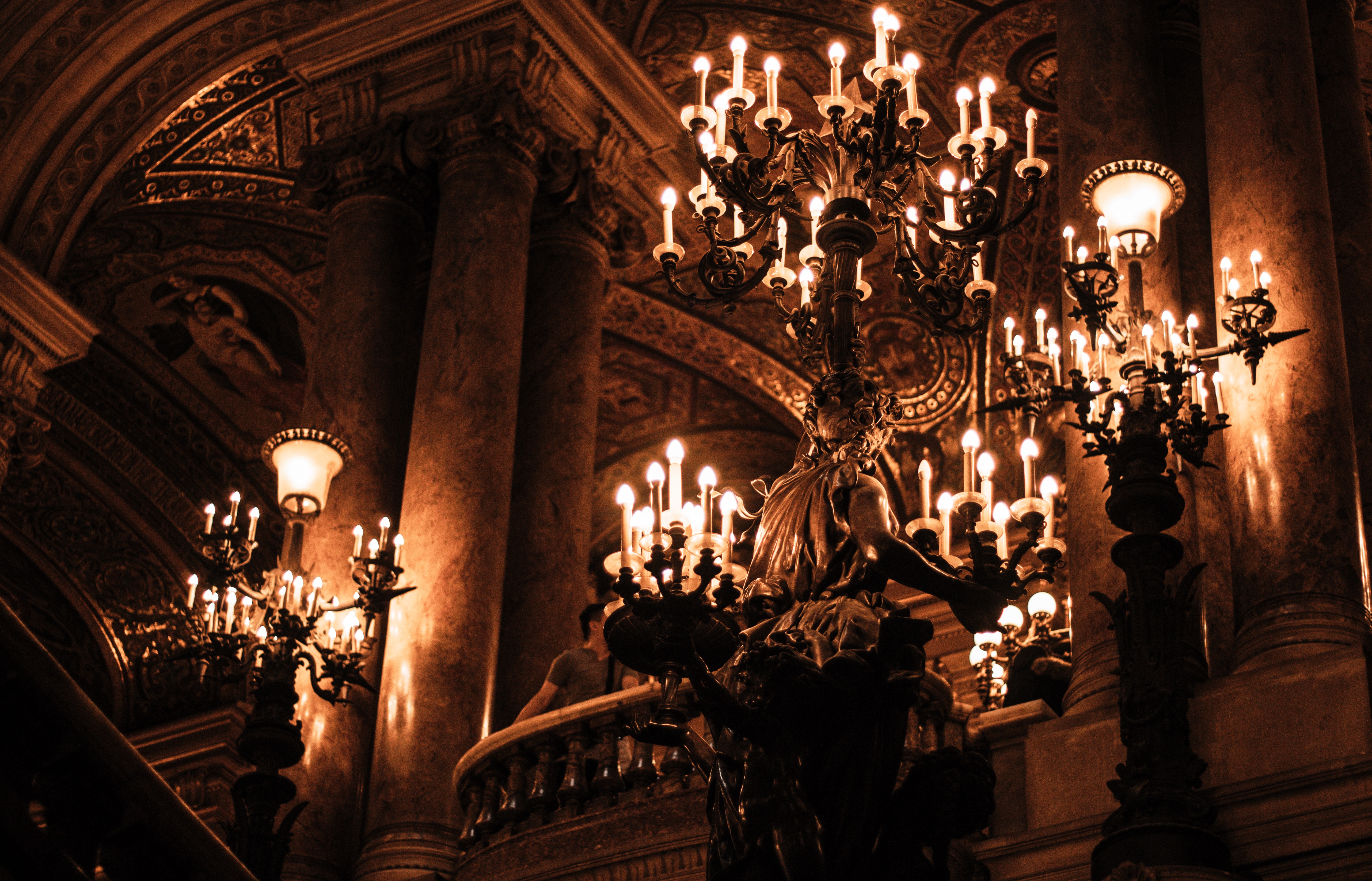 Ornate chandeliers in a grand opera house HD Wallpaper