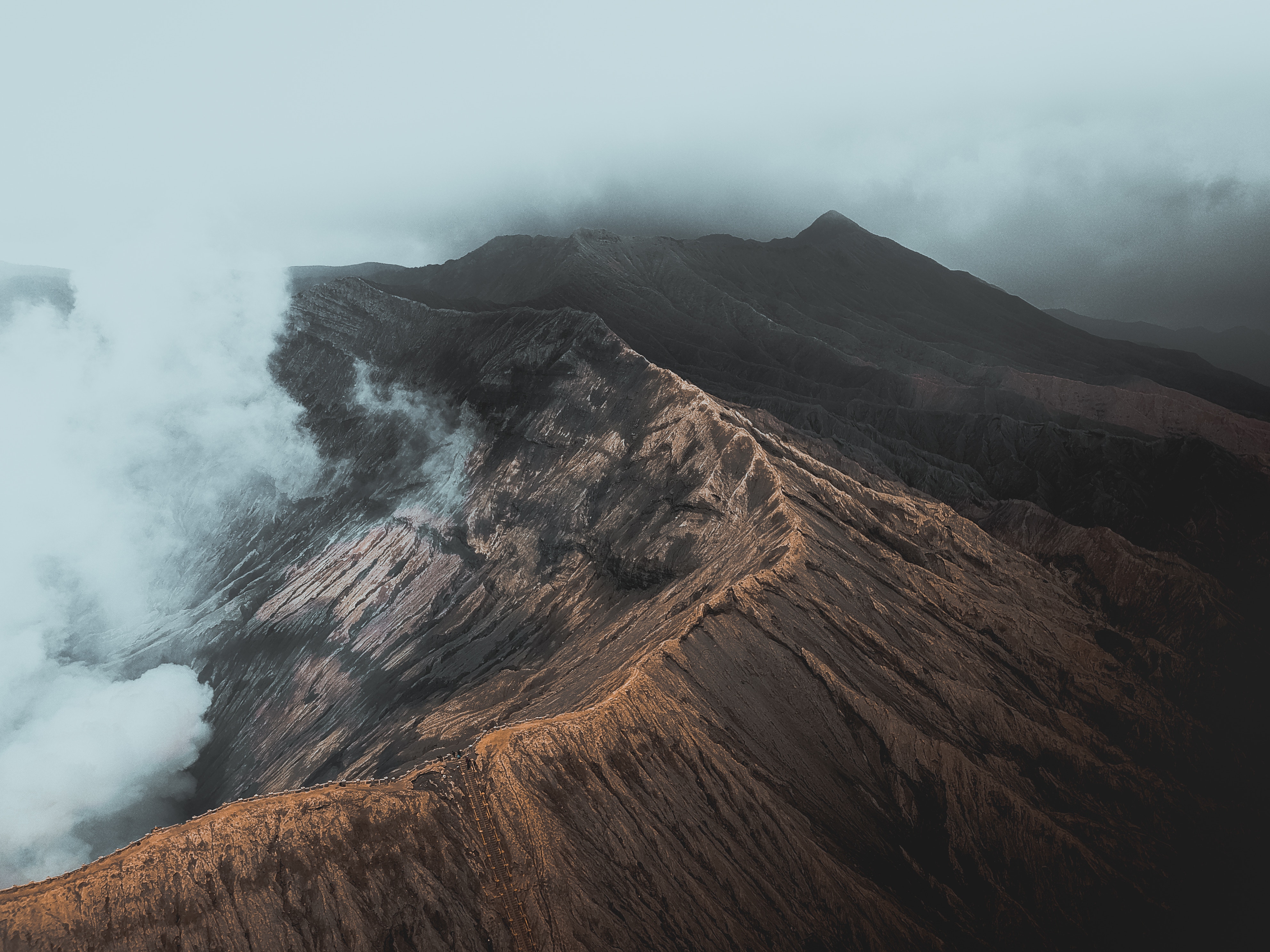 Volcano crater with smoke and mist HD Wallpaper