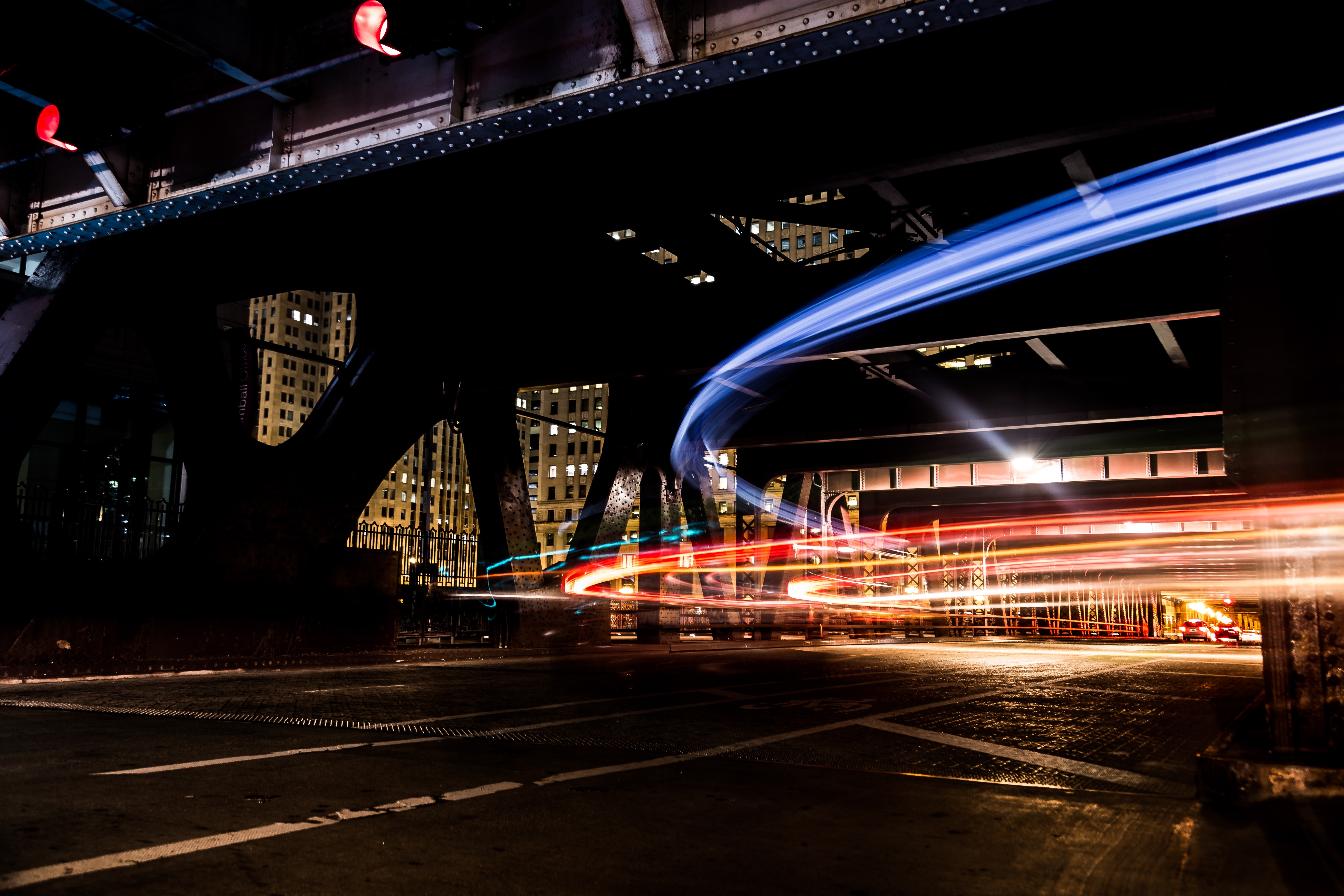 Light trails under a bridge in Chicago at night HD Wallpaper