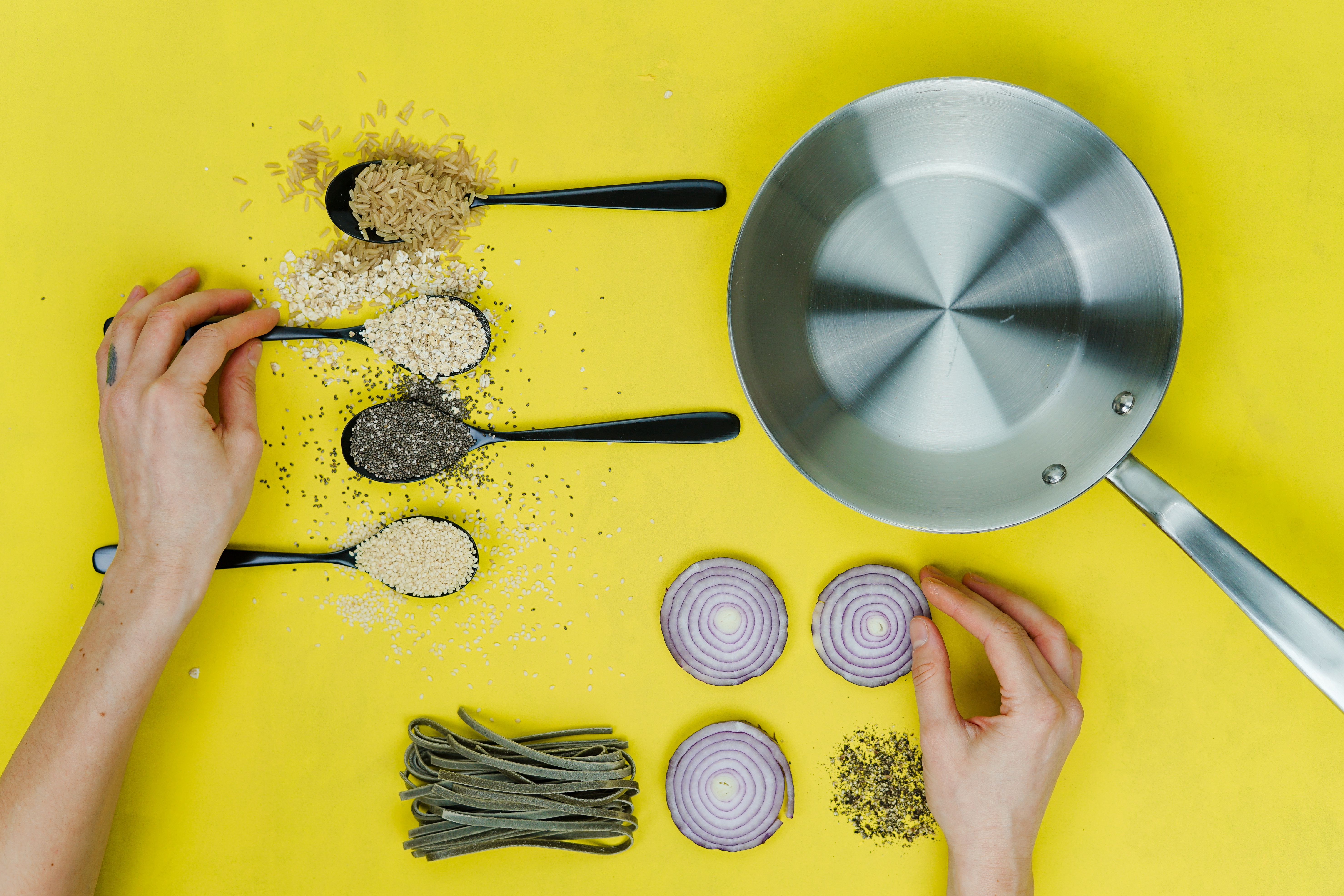 Spices, Sliced Onion, Beans, and Pan on Yellow Table HD Wallpaper