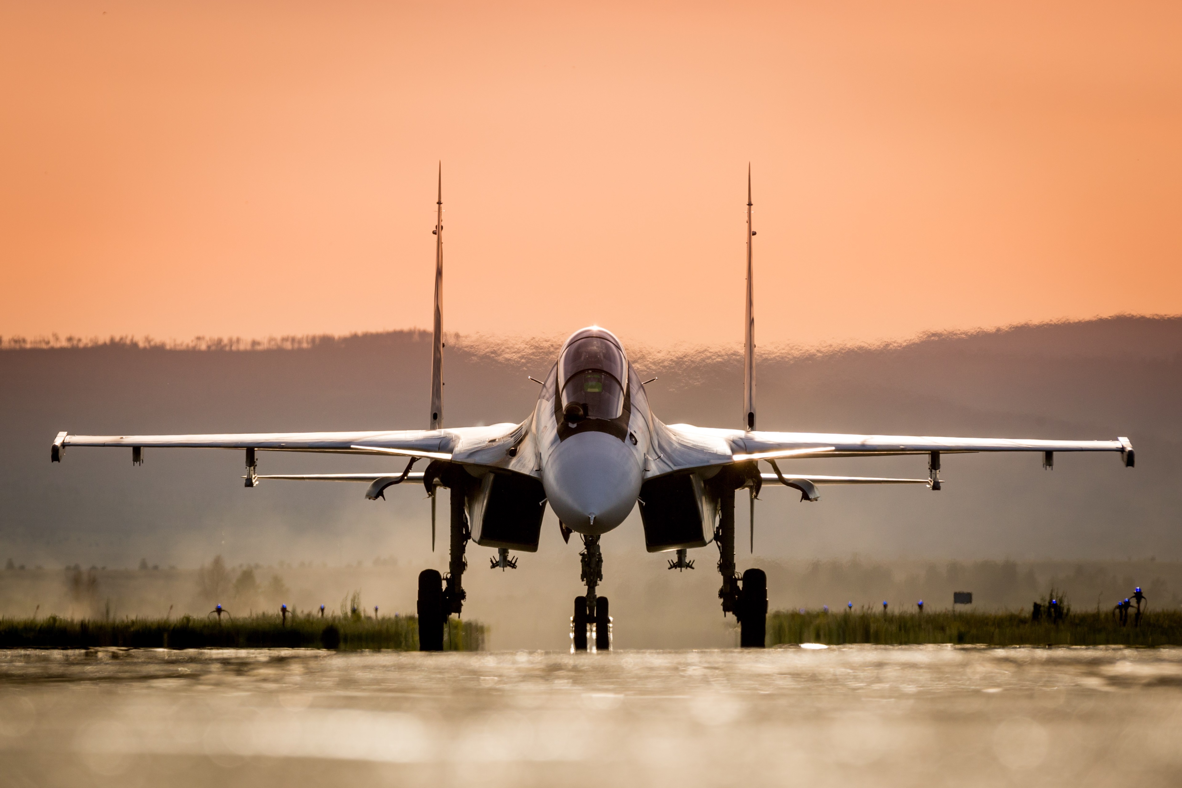 Sukhoi Su-30 fighter jet on runway at sunset HD Wallpaper