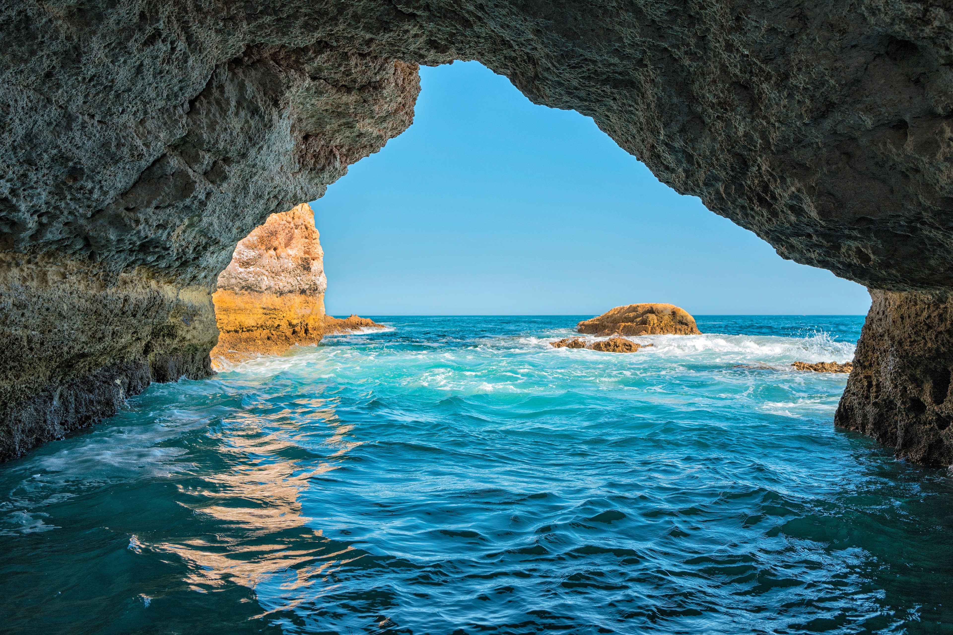 Cave entrance overlooking the ocean HD Wallpaper