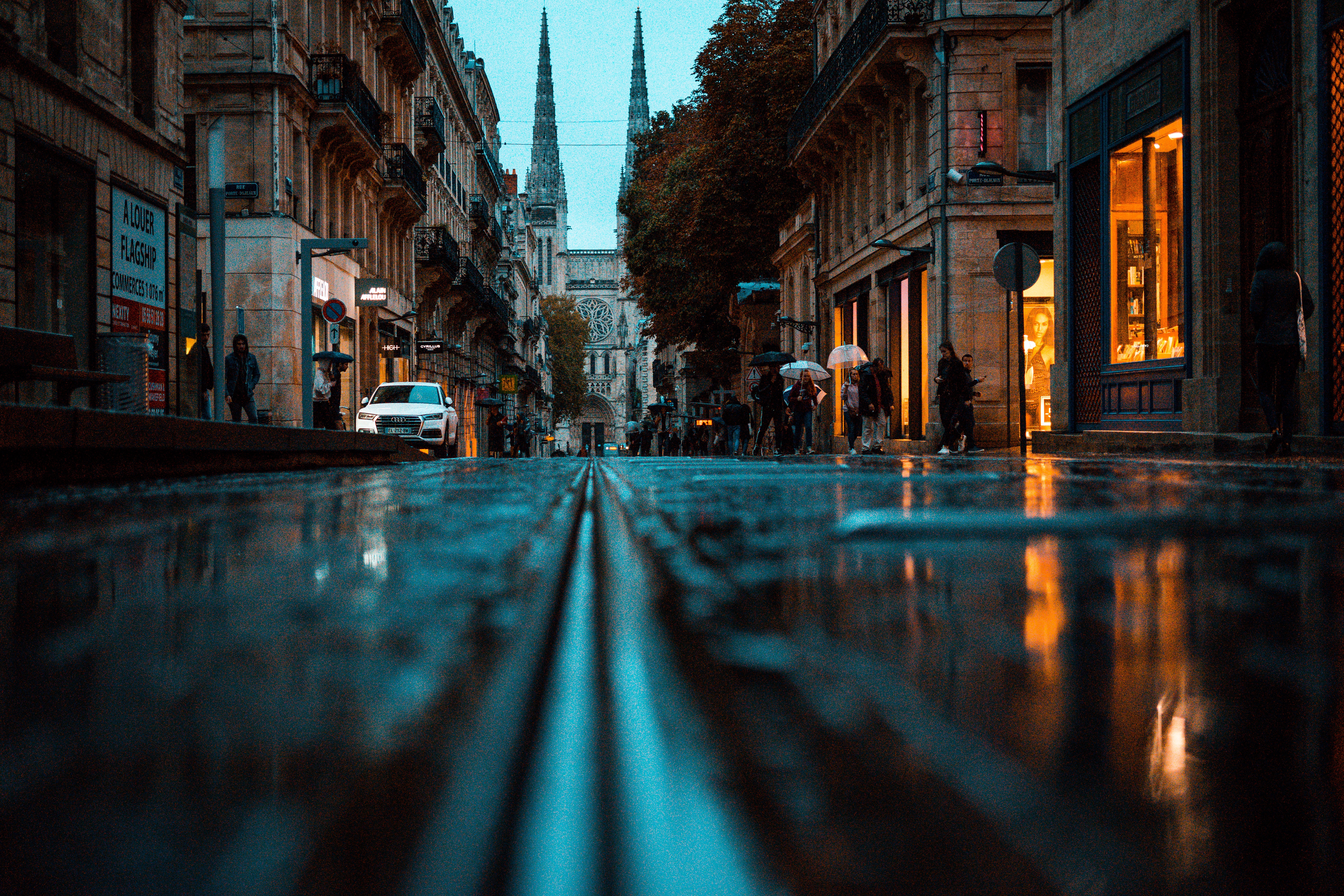 Street with puddles and cathedral in Bordeaux HD Wallpaper
