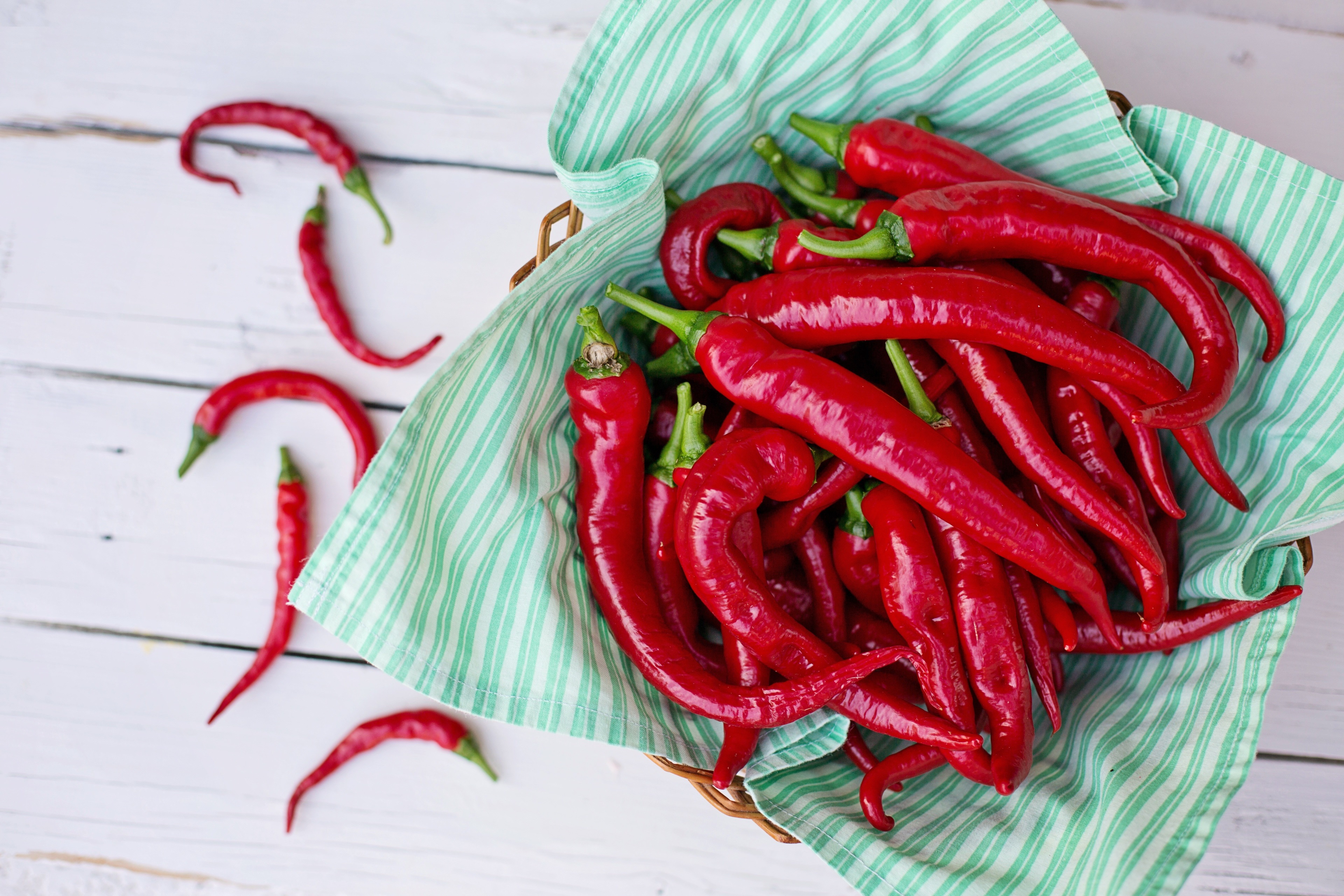 Red chili peppers in a basket HD Wallpaper