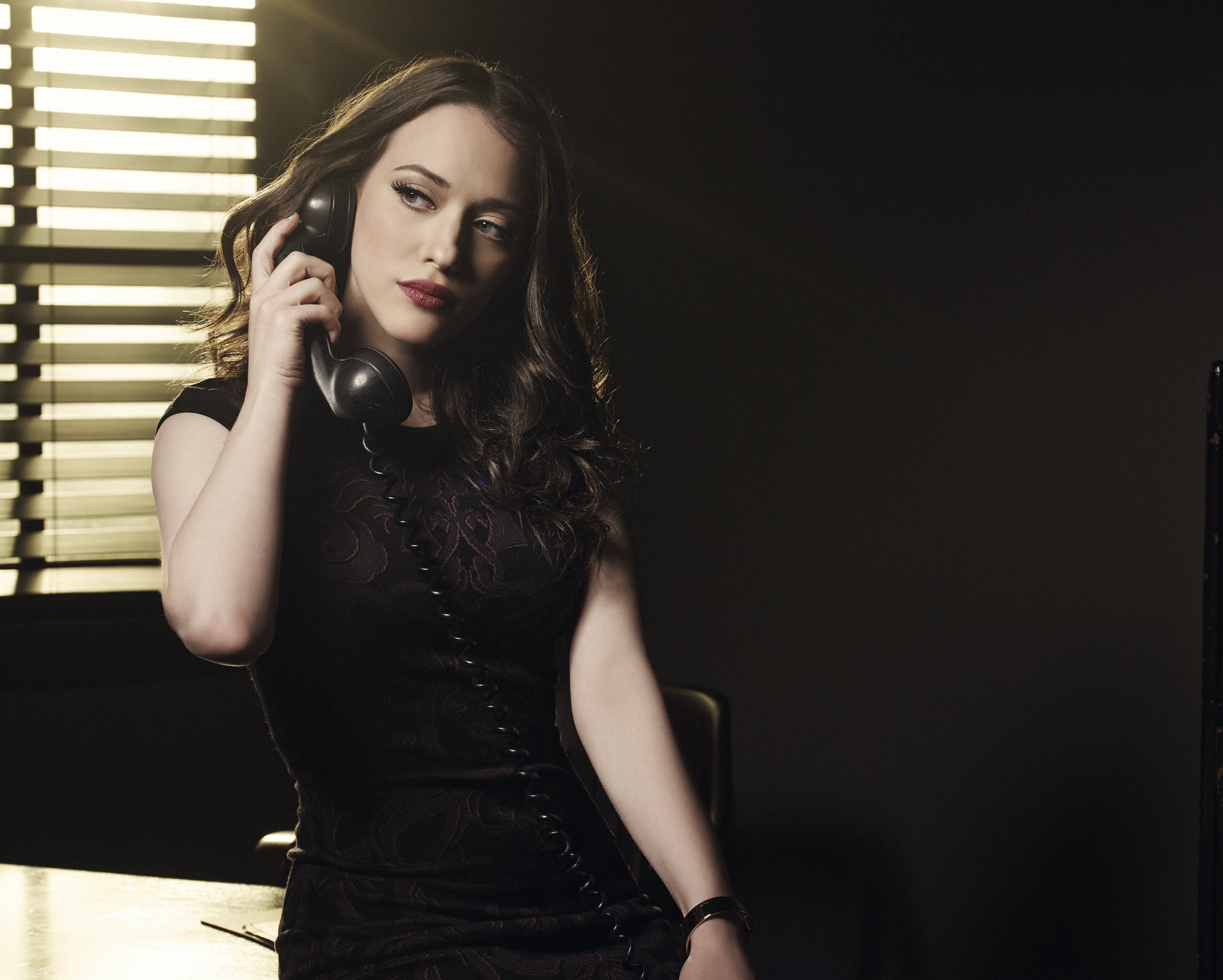 Kat Dennings on a phone HD Wallpaper