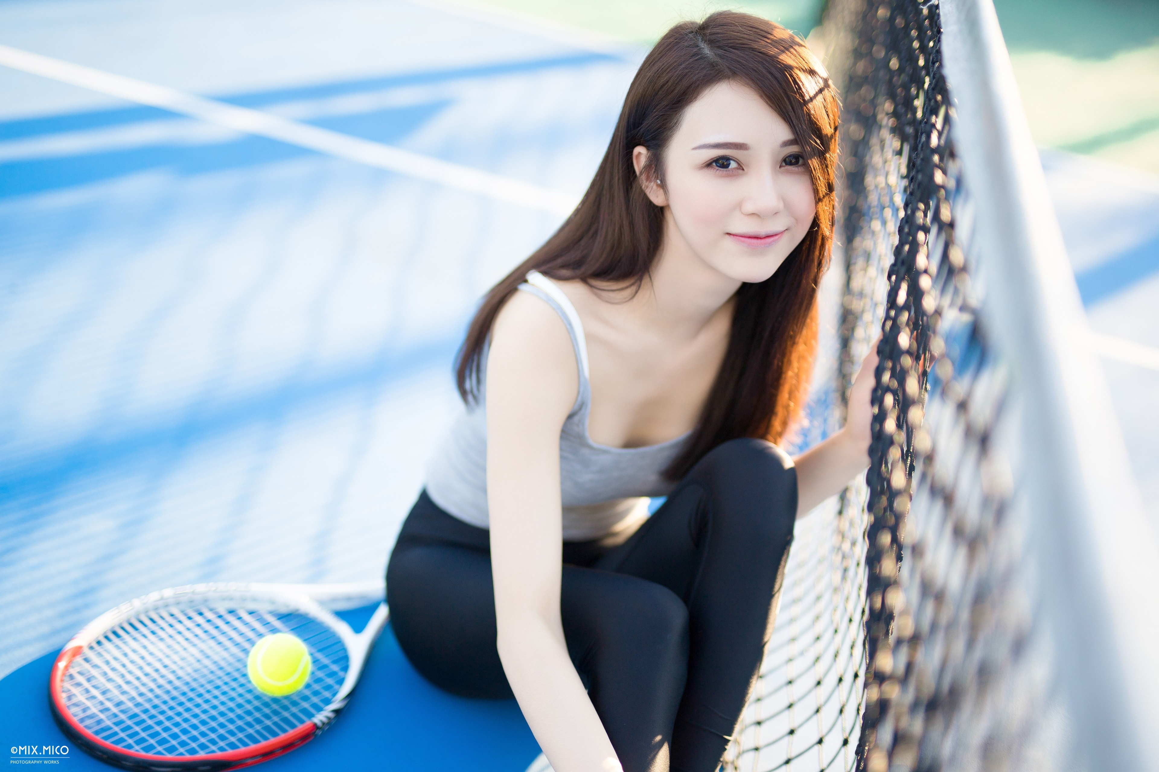 4K Portrait of Smiling Asian Woman on Tennis Court HD Wallpaper