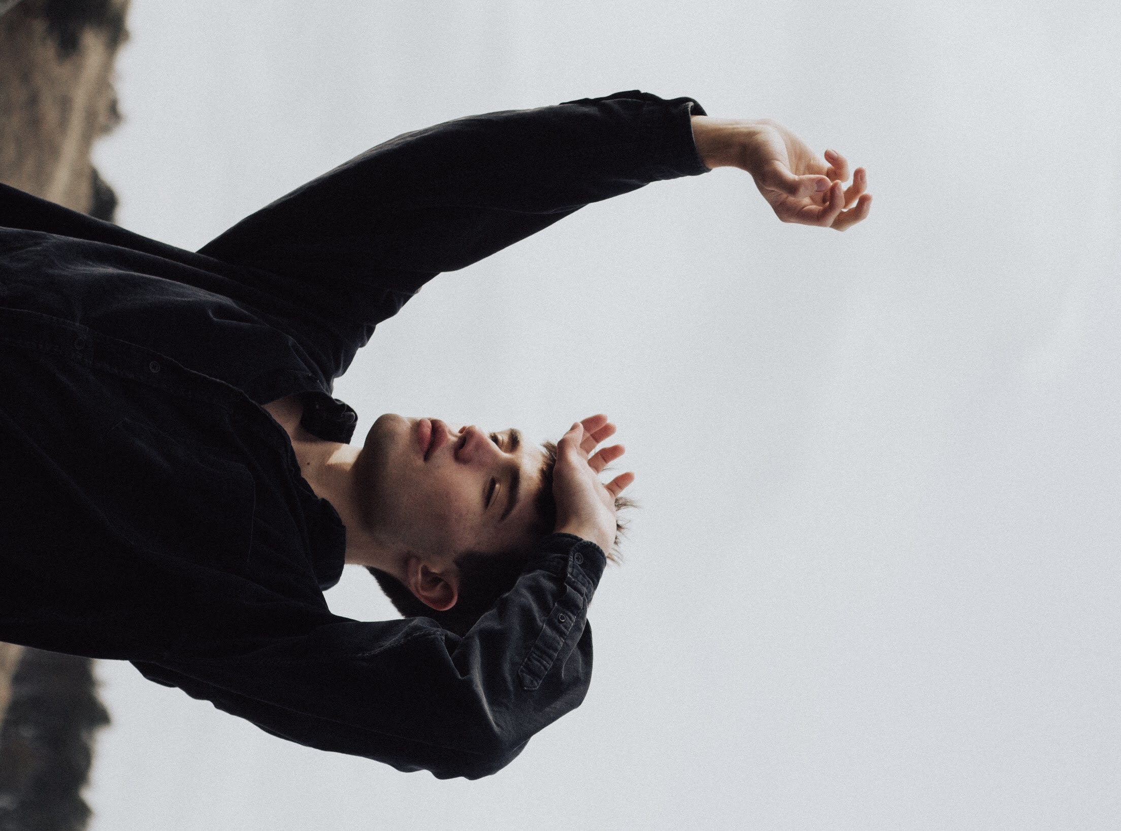 Man in black shirt with hands raised HD Wallpaper
