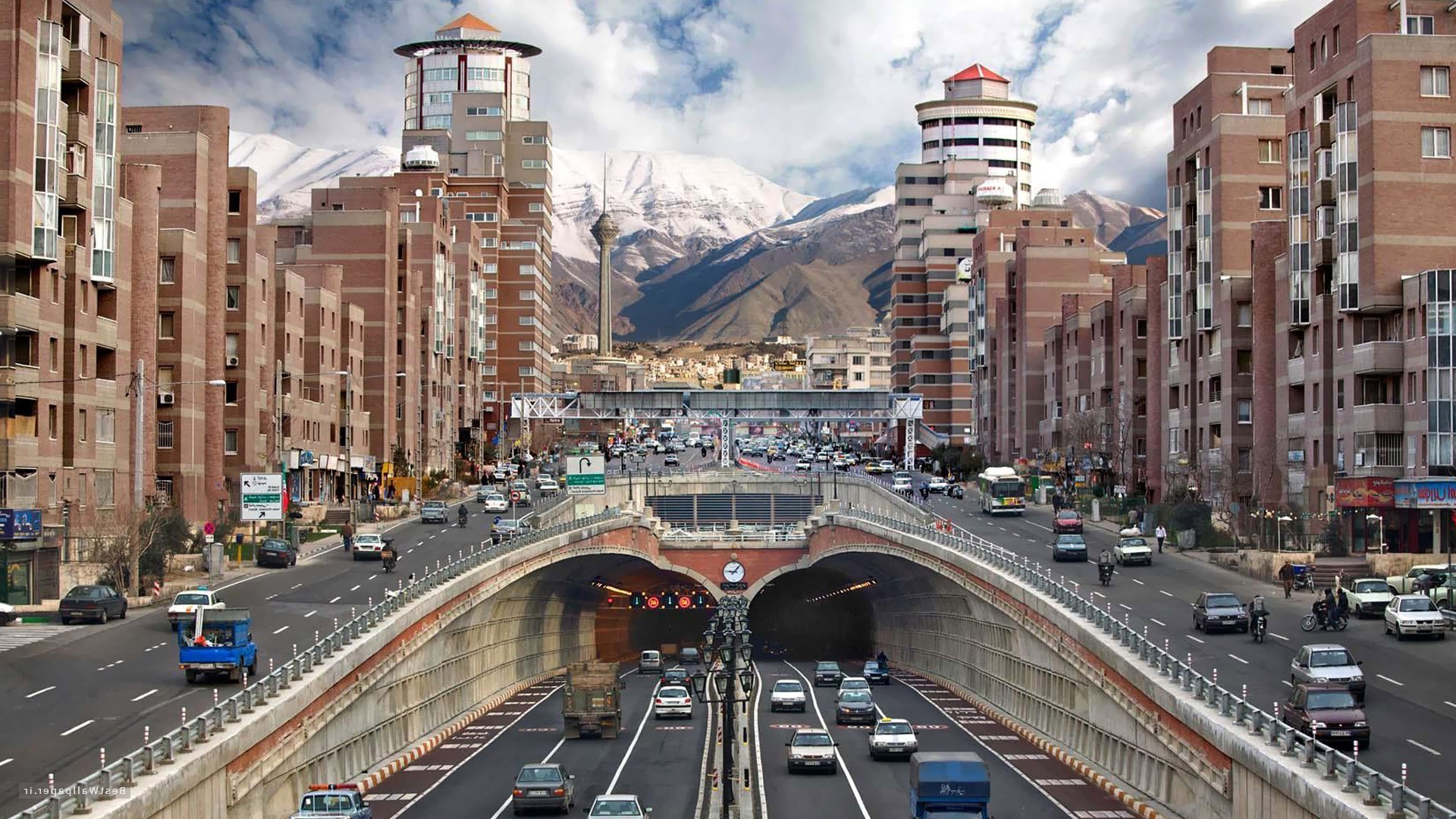 Tehran cityscape with mountains and traffic HD Wallpaper