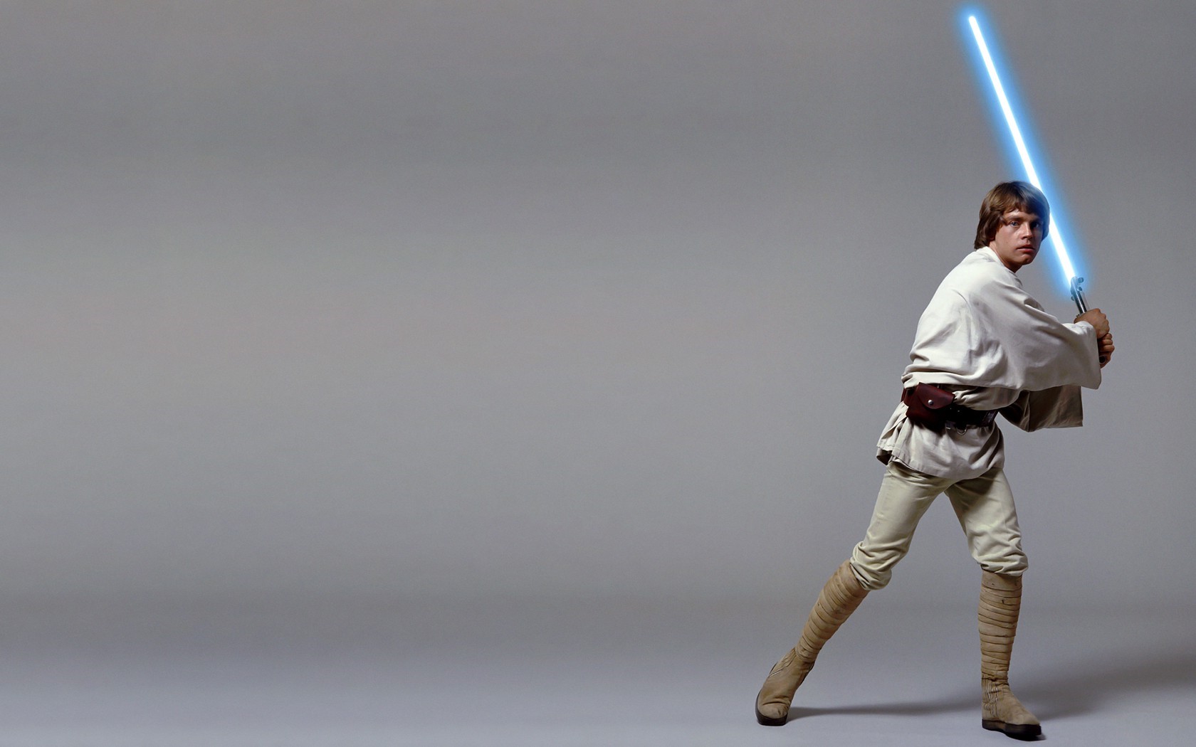 Luke Skywalker from Star Wars holding a lightsaber HD Wallpaper