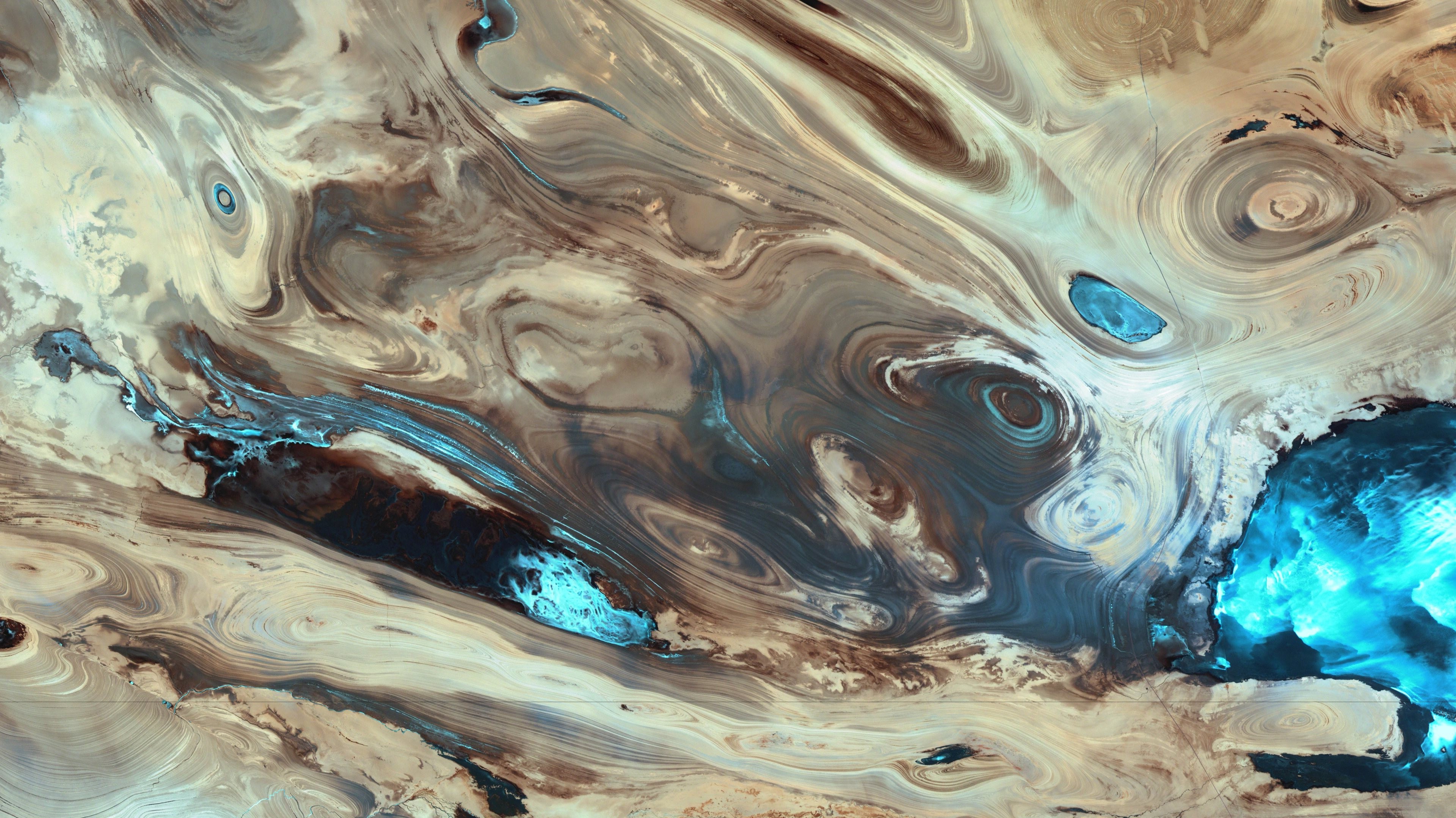 Abstract desert landscape with swirling patterns and water HD Wallpaper