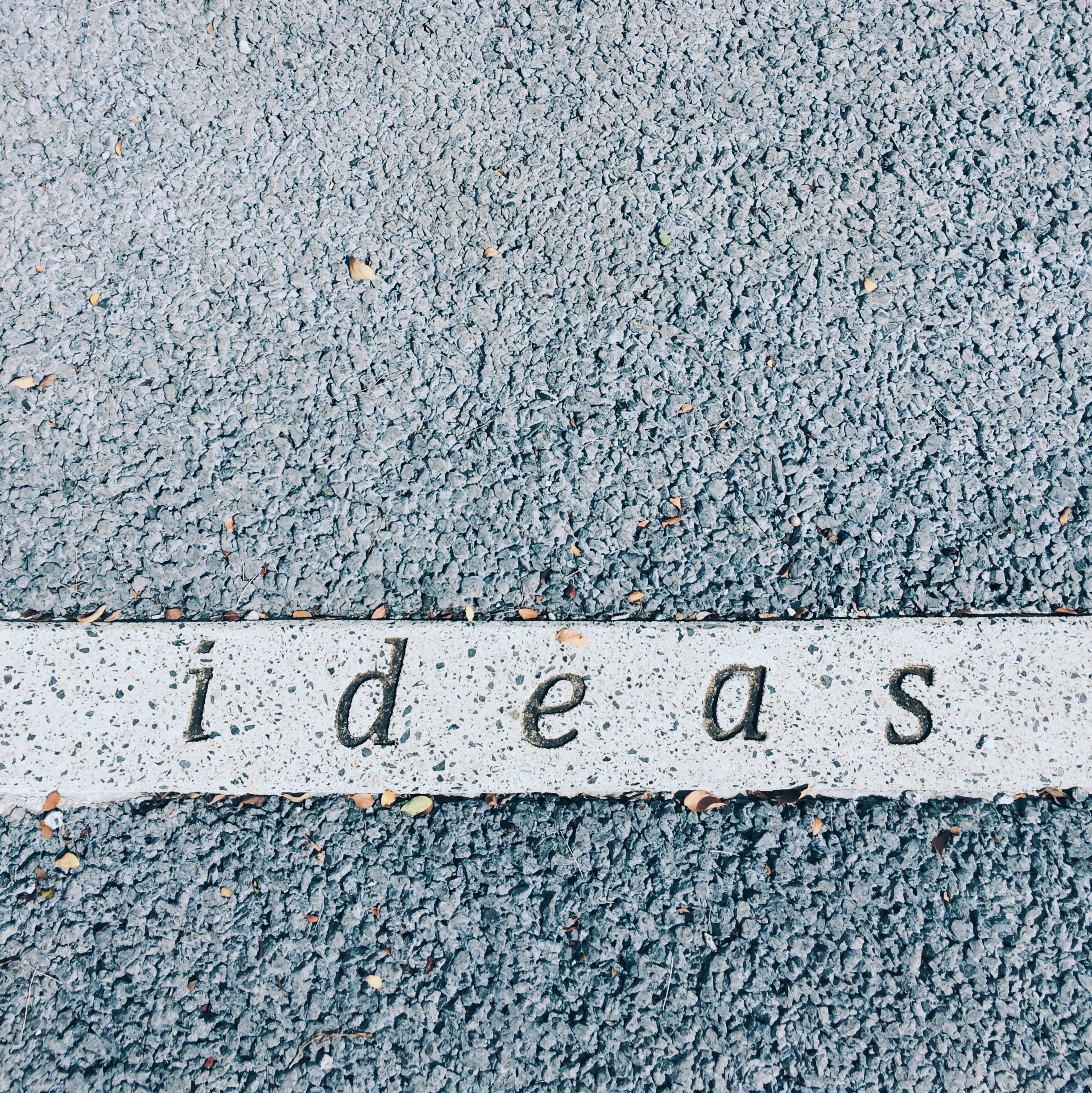 The word "ideas" carved into a concrete strip HD Wallpaper