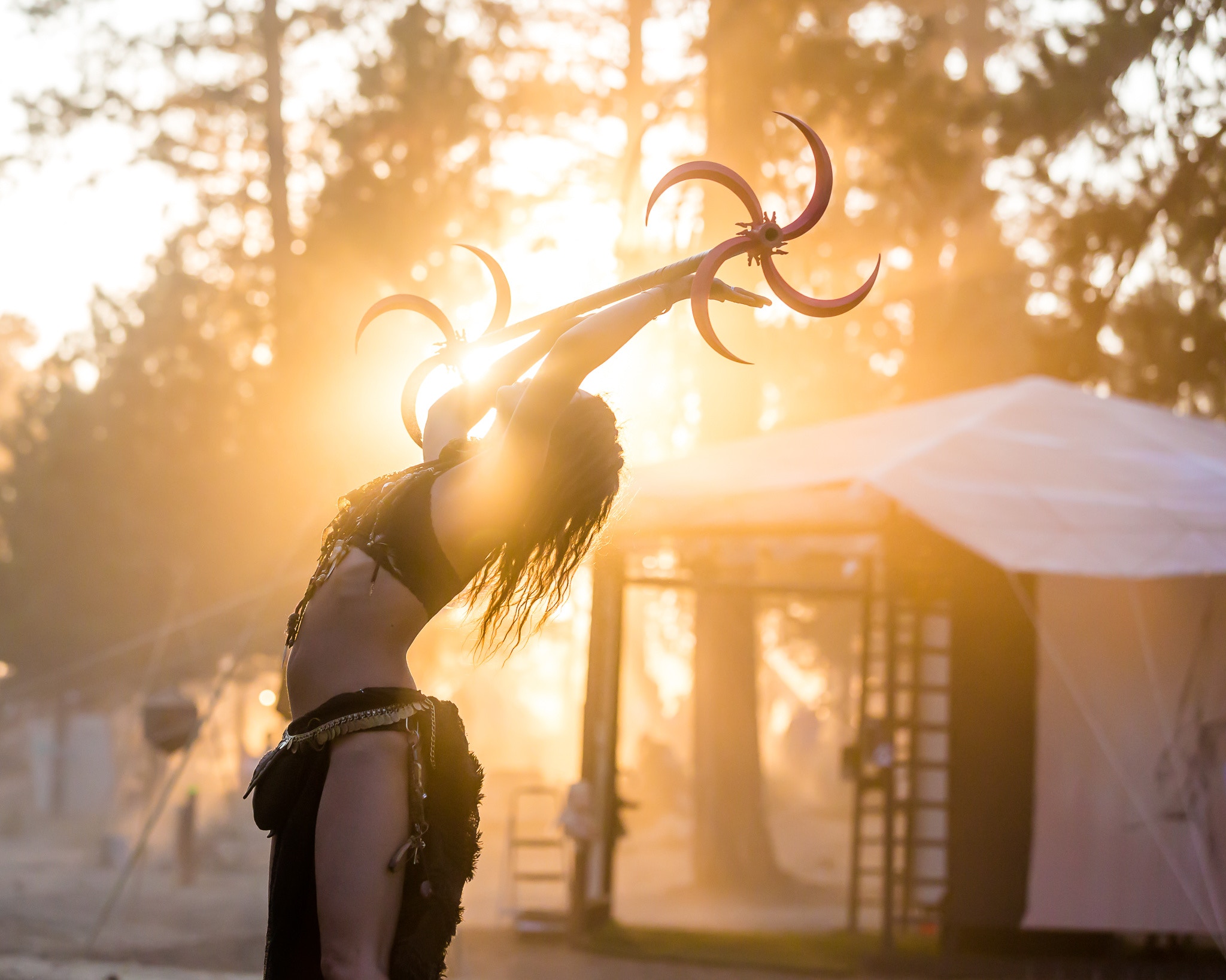 Woman performing with a dragonstaff at sunset HD Wallpaper