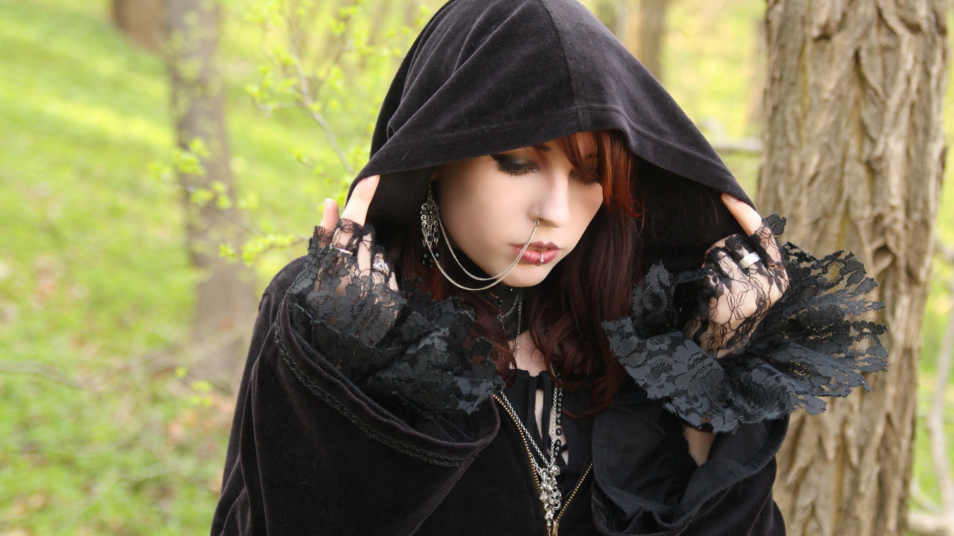 Gothic woman with piercings and black hood HD Wallpaper